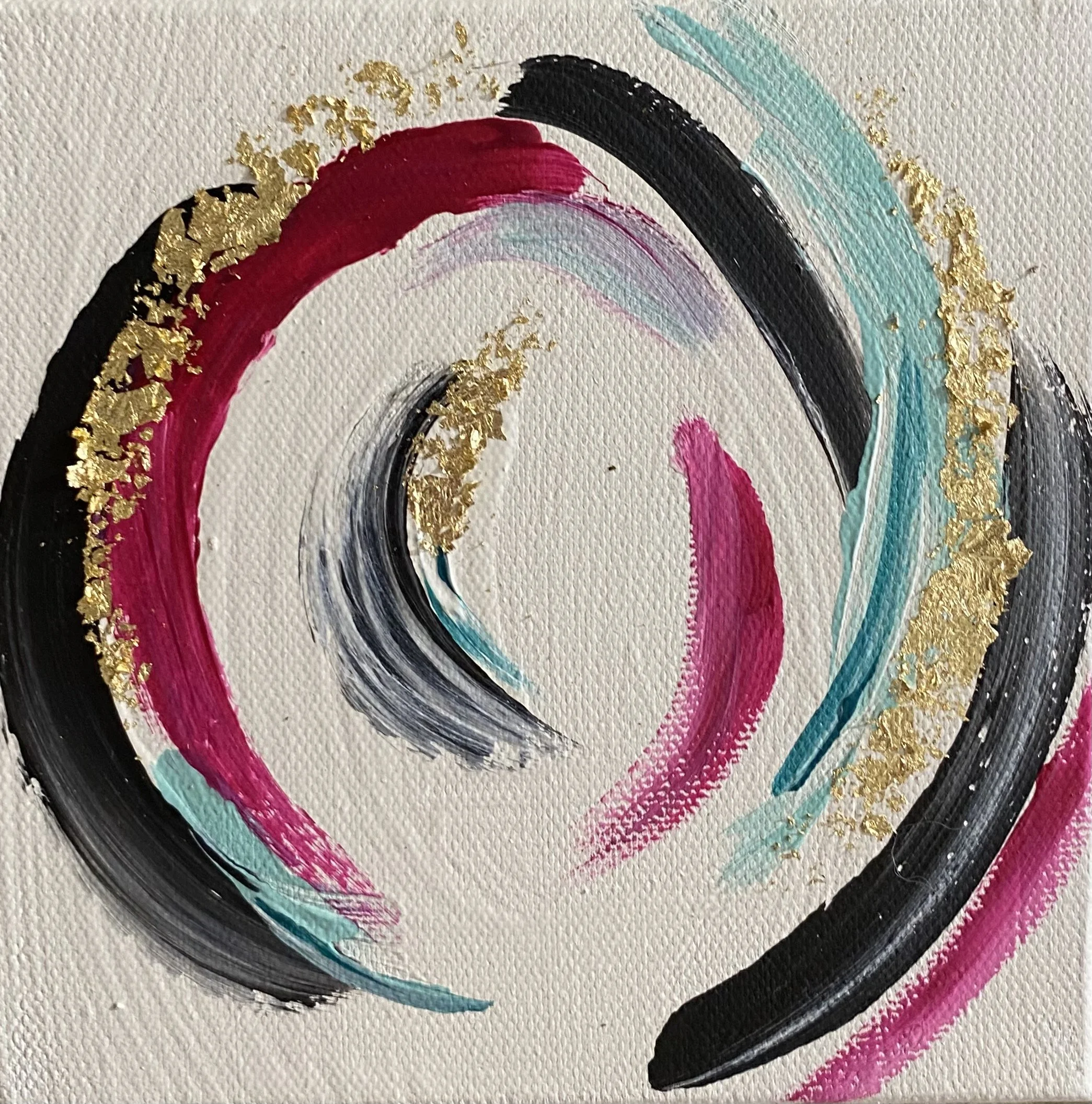Abstract painting with swirling brushstrokes in black, pink, and light blue, accented with gold leaf details on a white canvas.