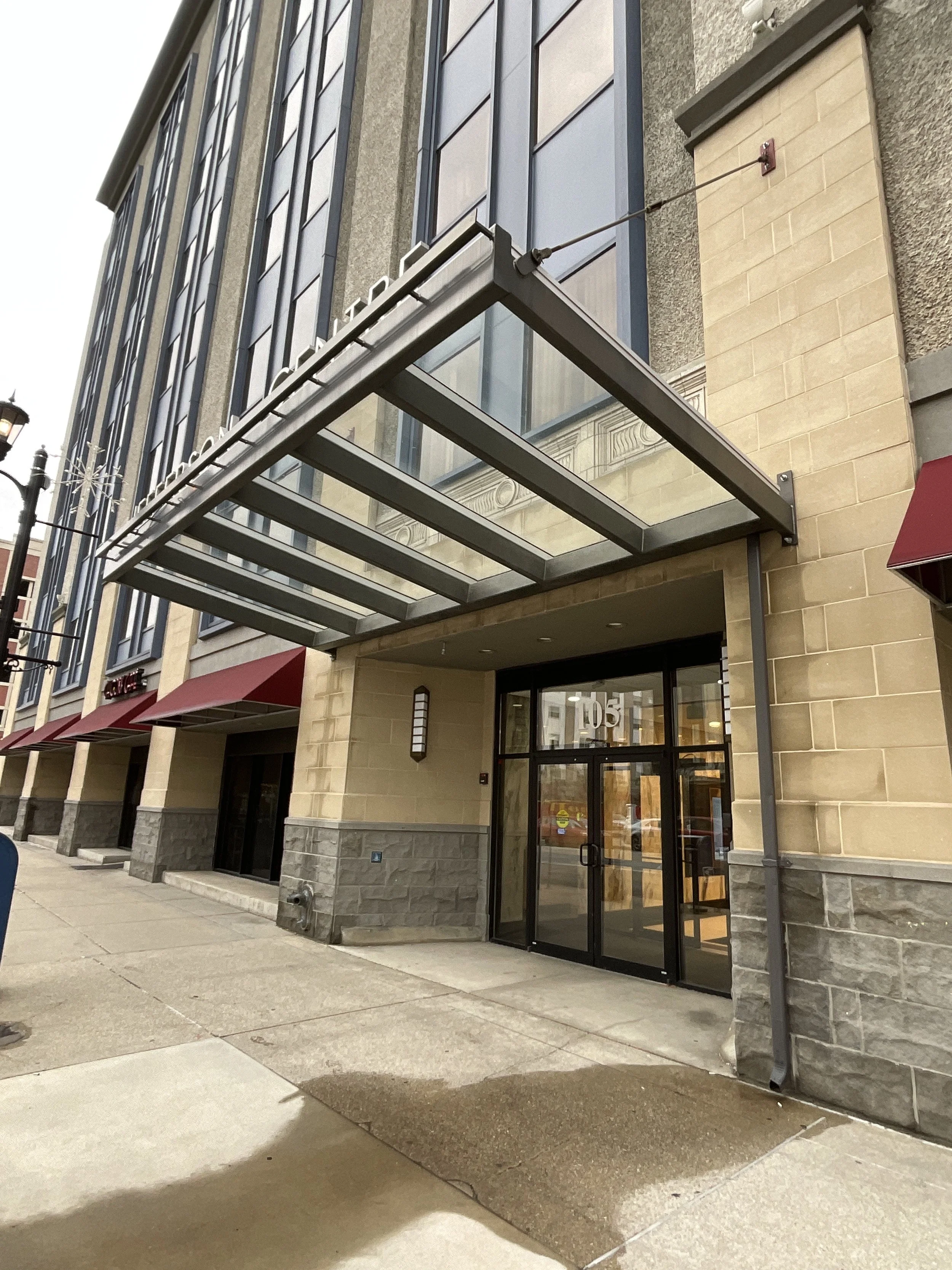 Exterior metal entry canopy fabricated for a commercial building.