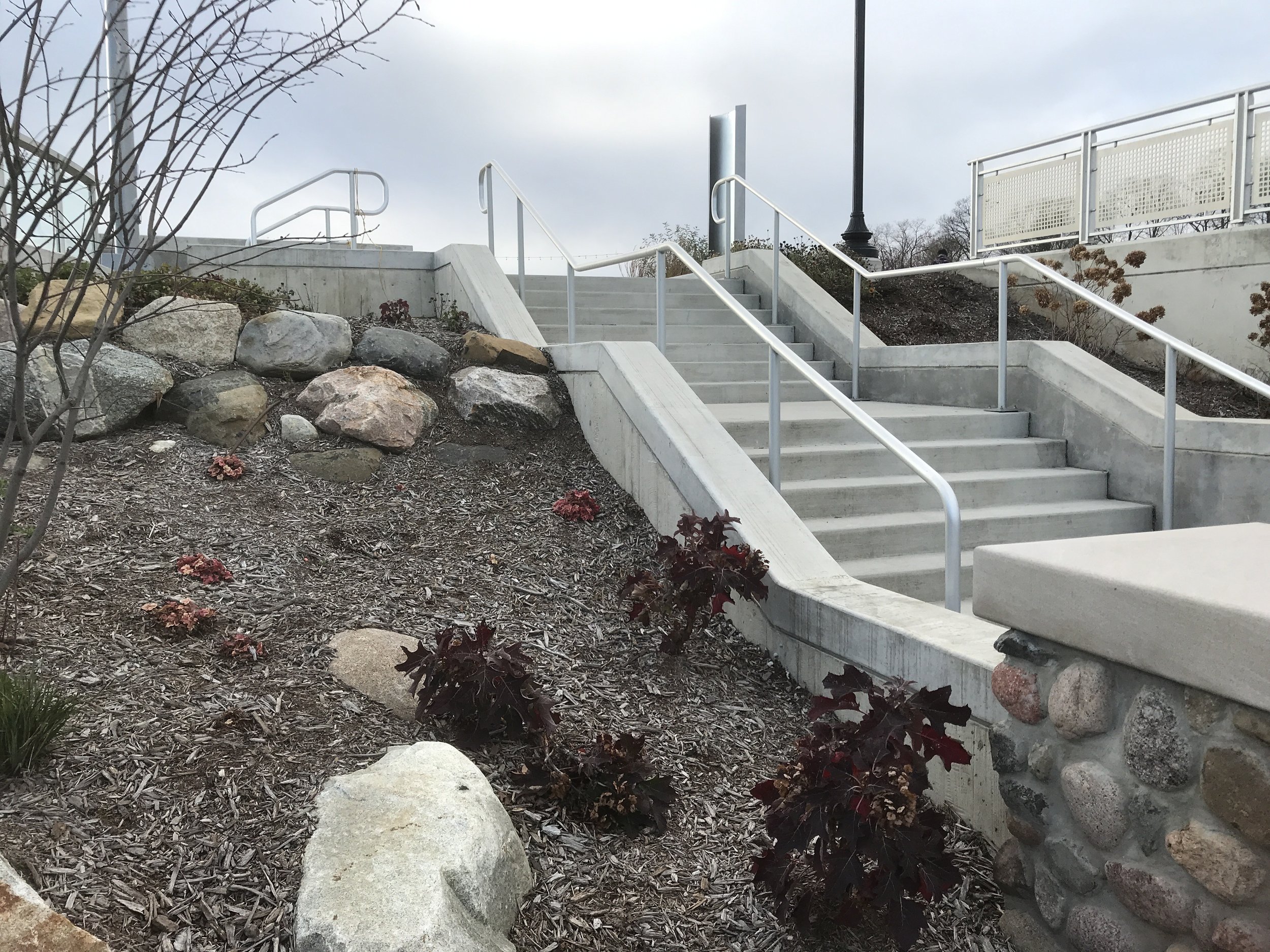 Pedestrian Stairway with Aluminum Handrails Providing Access Between River Levels.