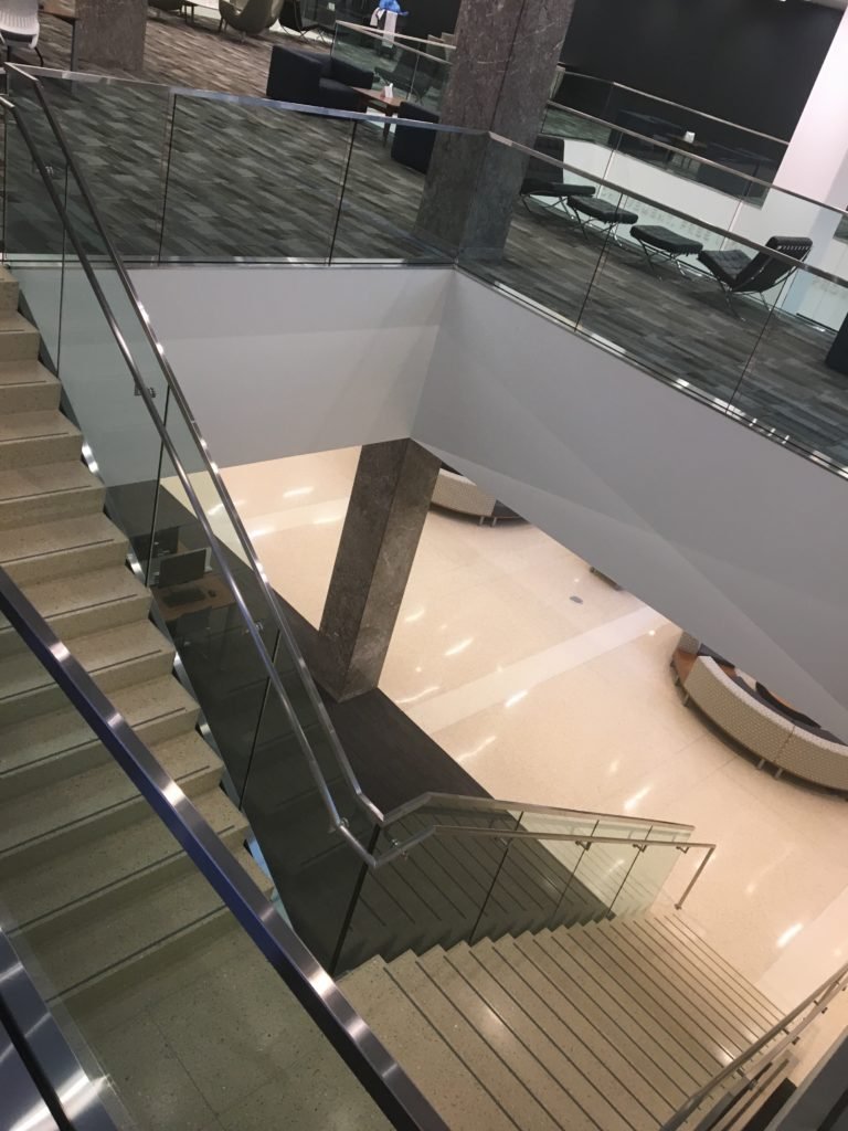 Floating Interior Stair System with Custom Metal Guardrails Fabricated for Notre Dame Hesburgh Library. 