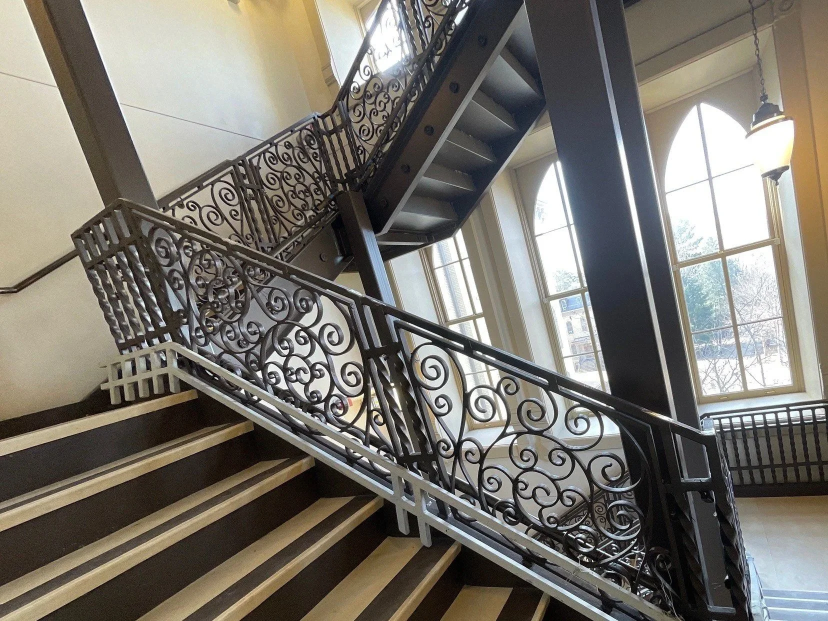 Decorative Scrollwork Railing Panels Integrated Into the Grand Staircase of the Eck Visitors Center.