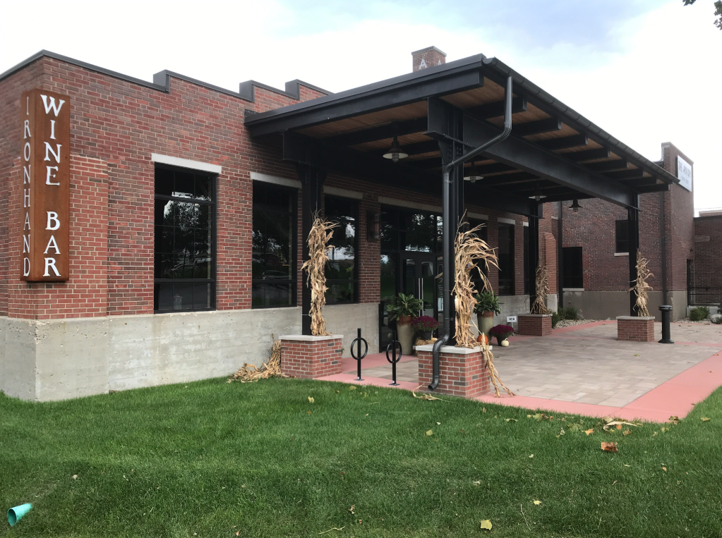Structural steel entrance canopy fabricated and installed to create a covered patio area at Ironhand Wine Bar.