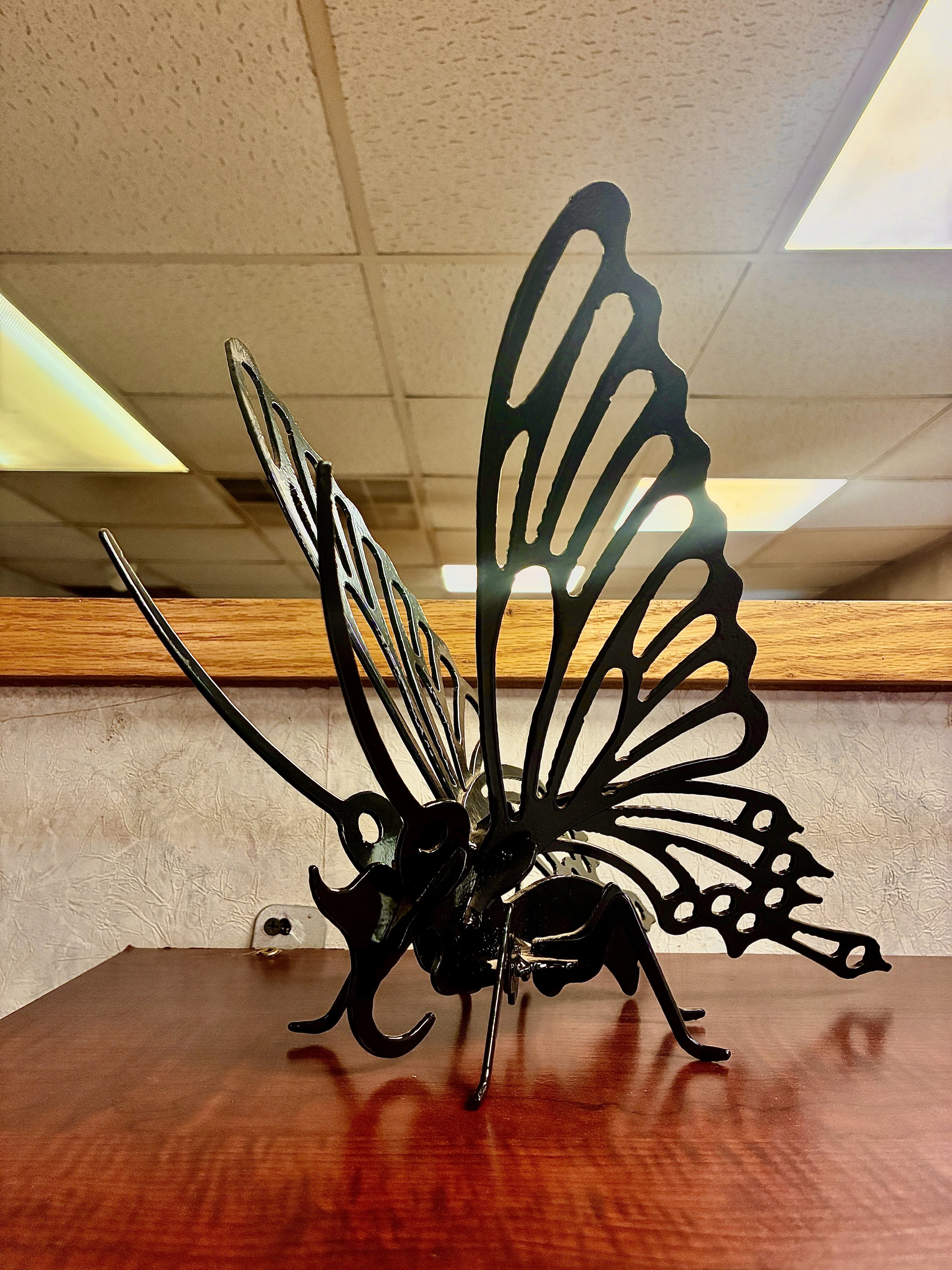 Custom fabricated metal butterfly sculpture.
