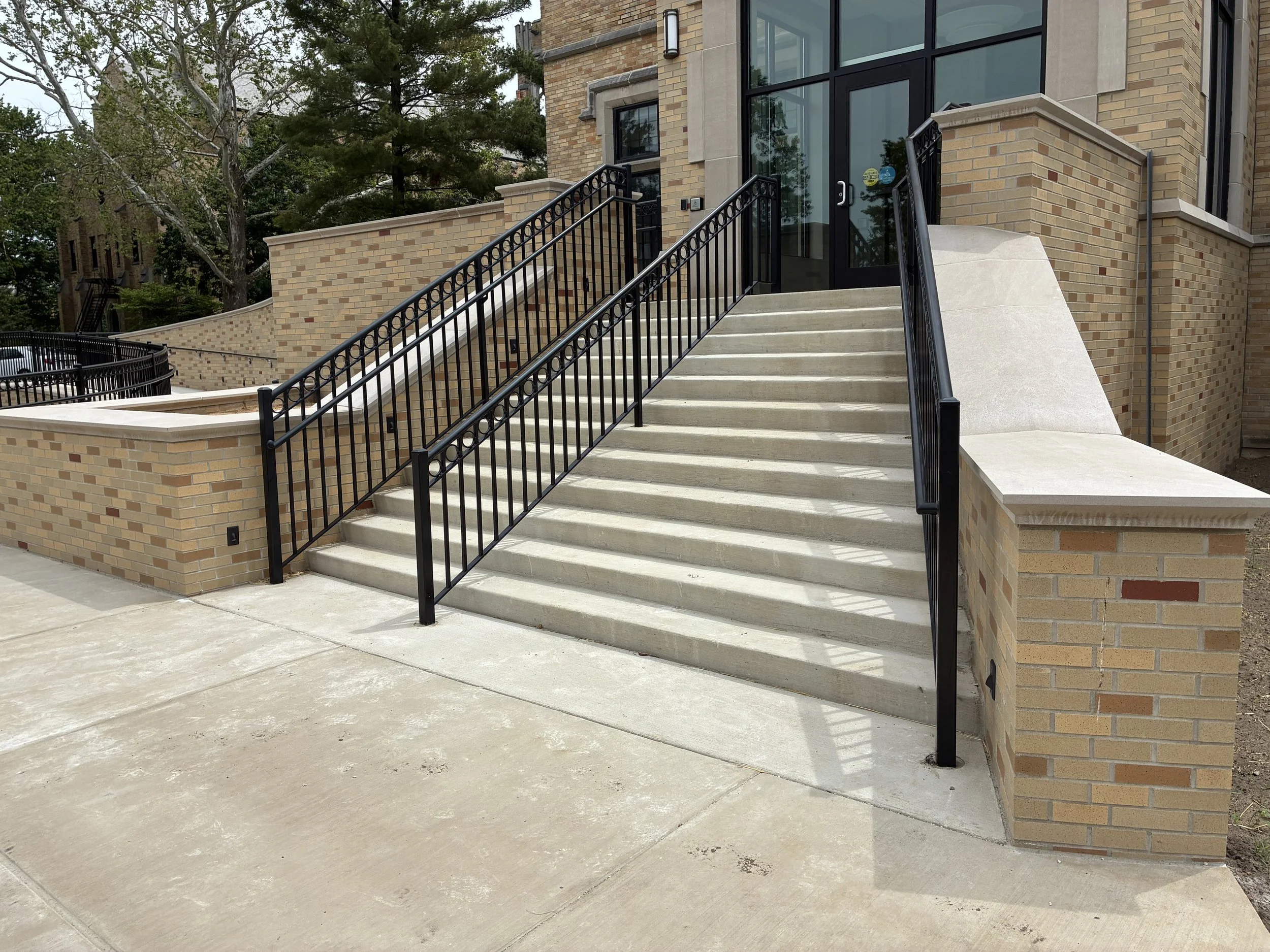 Full Stair Access with Integrated Railing System at LeMans Hall, Maintaining Consistent Alignment and Finish.
