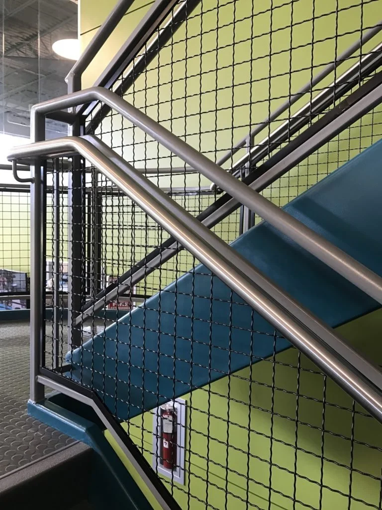 Handrail and Mesh Guardrail Infill Detail at Stair Landing.