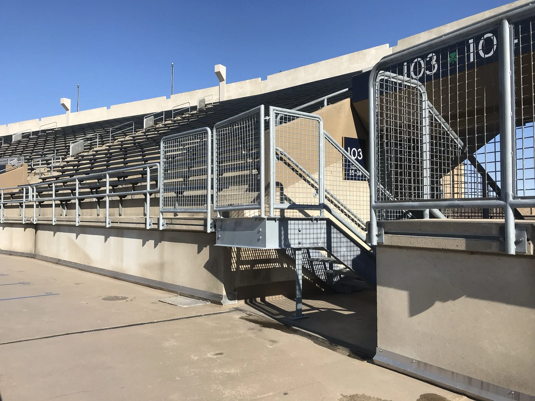 Custom Mesh Infill Guardrail and Stair Railing System Fabricated for Notre Dame Stadium.