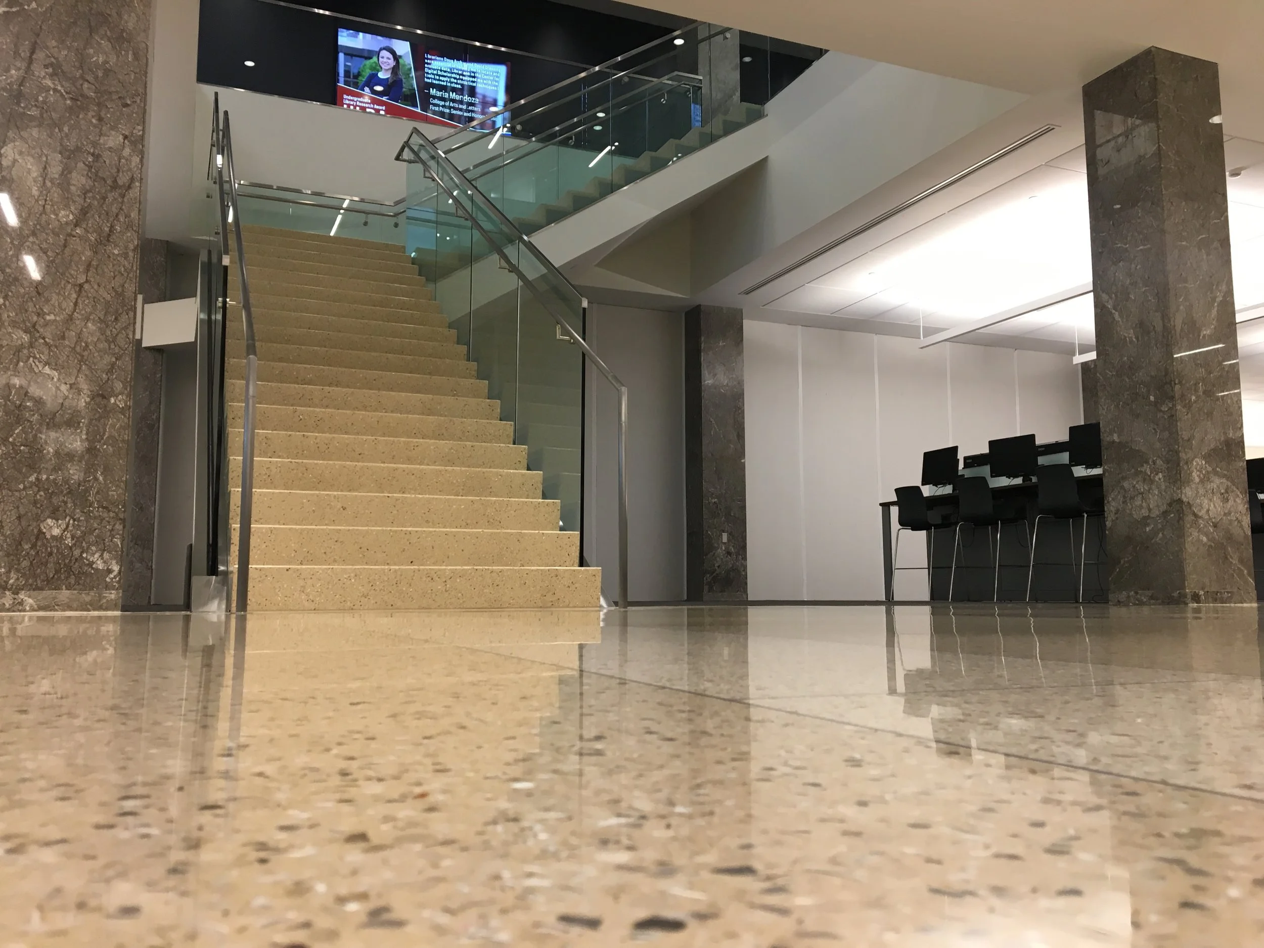 Multi-Level Glass Guardrail Installation Enhancing Functionality Throughout the Hesburgh Library Renovation.