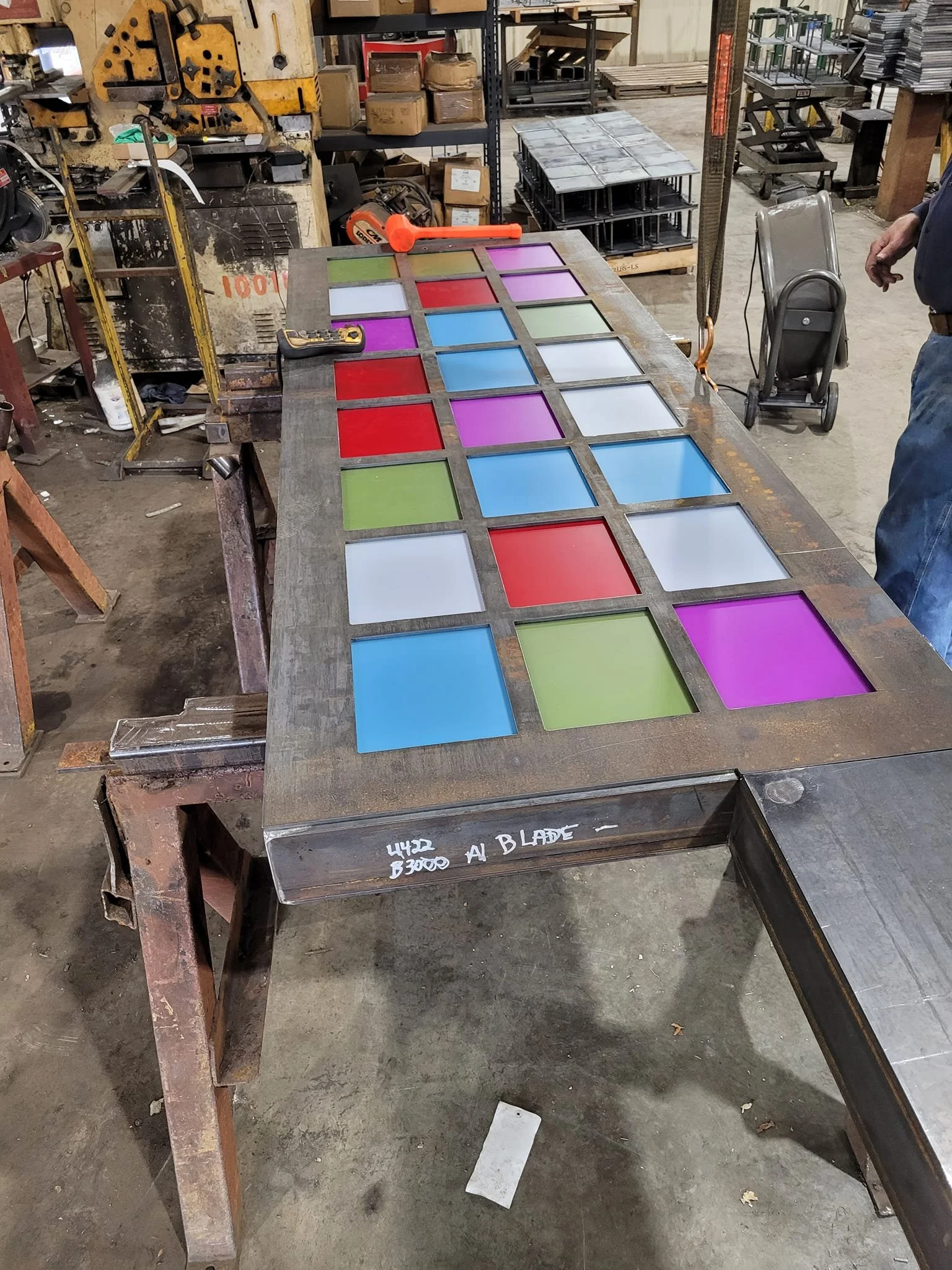 Fabricated metal components staged on worktable for State Road 19 project.