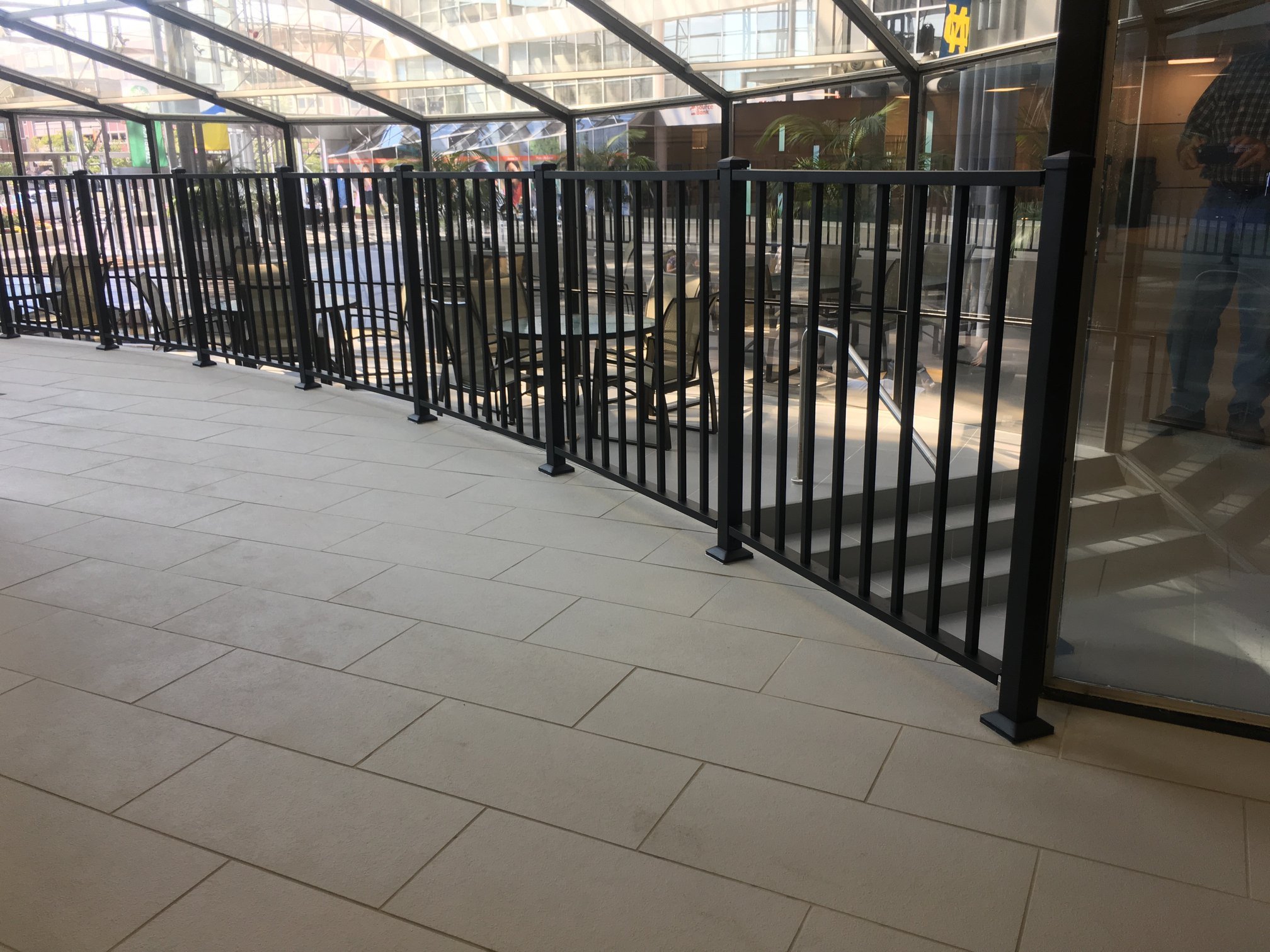 Continuous Steel Guardrail System Enclosing the Pool Perimeter within the Hotel Interior.