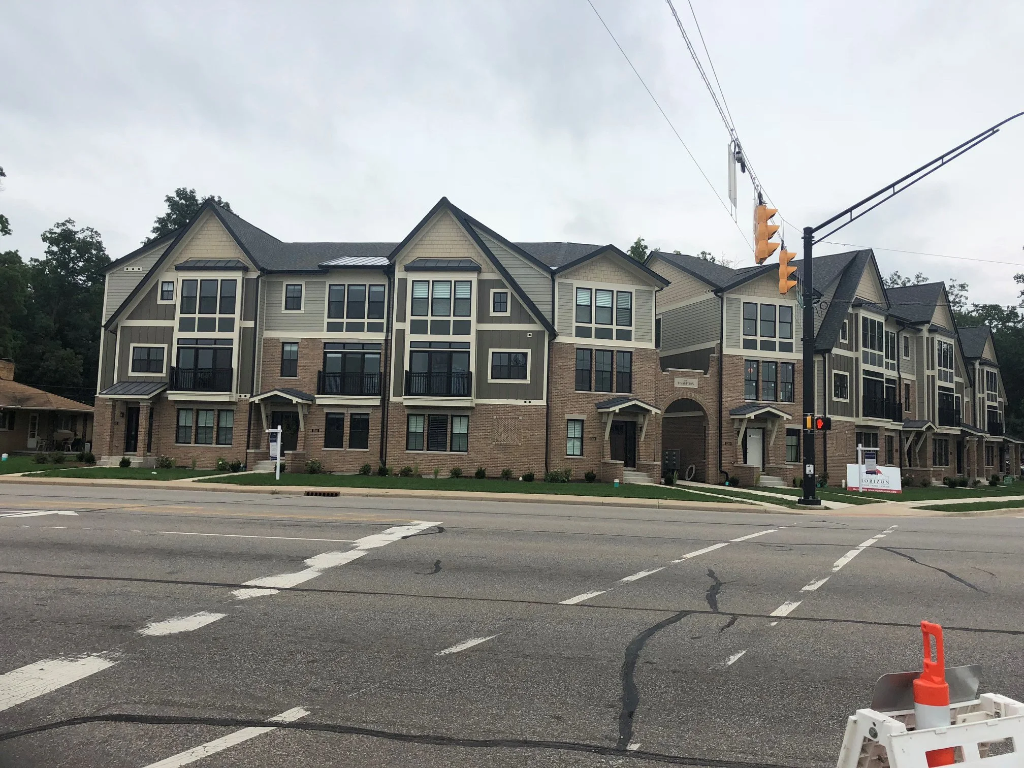 Exterior View of the Tradition Townhomes Featuring Custom Metal Balcony Railings Integrated Across the Residential Development.