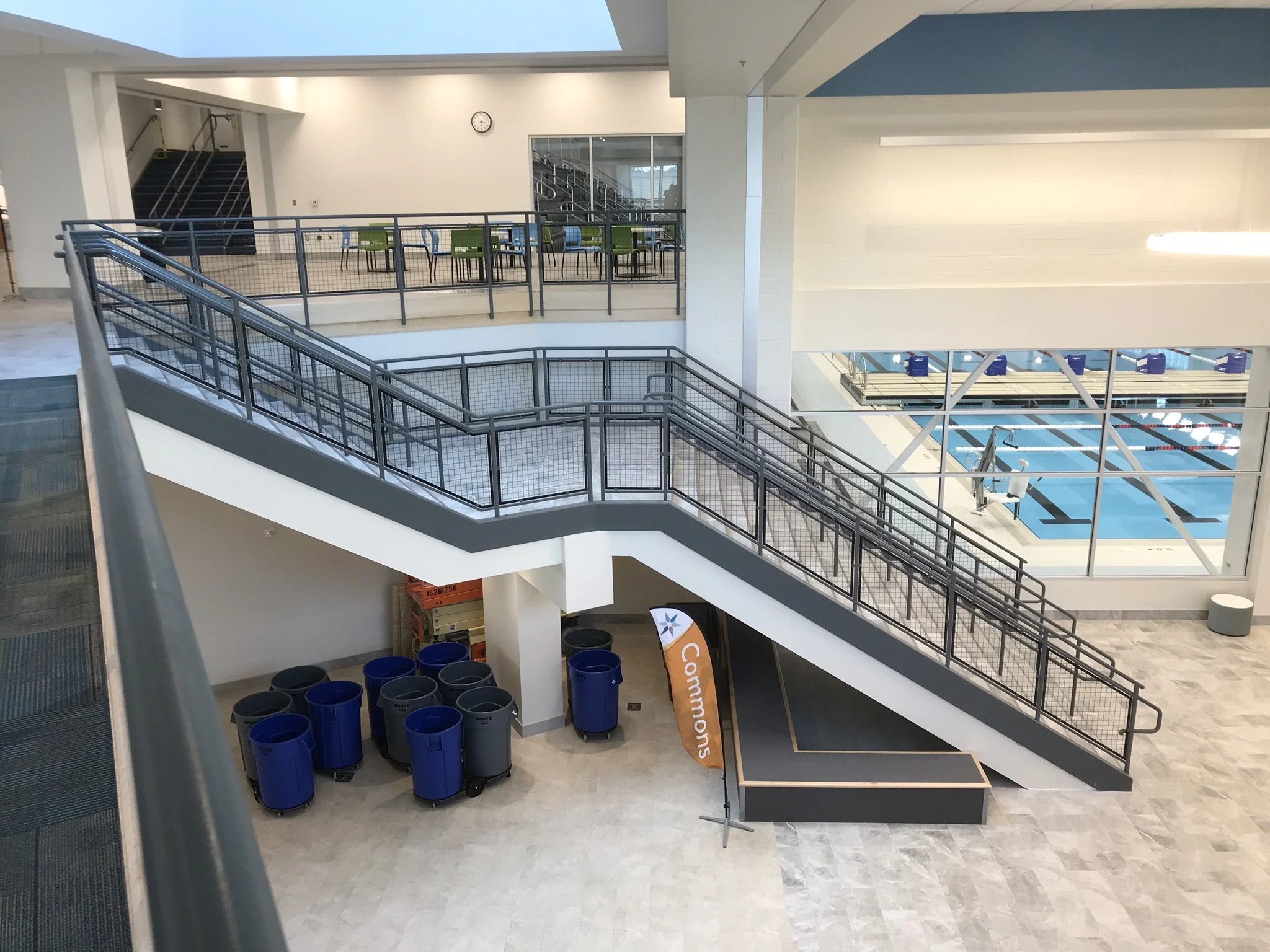 Interior Steel Stair, Landing, and Guardrail System Overlooking Aquatics Facility. 