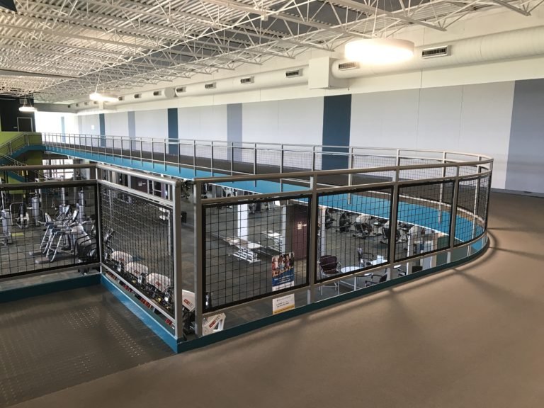 Upper-Level Circulation Railing Integrated into Fitness Facility Layout.