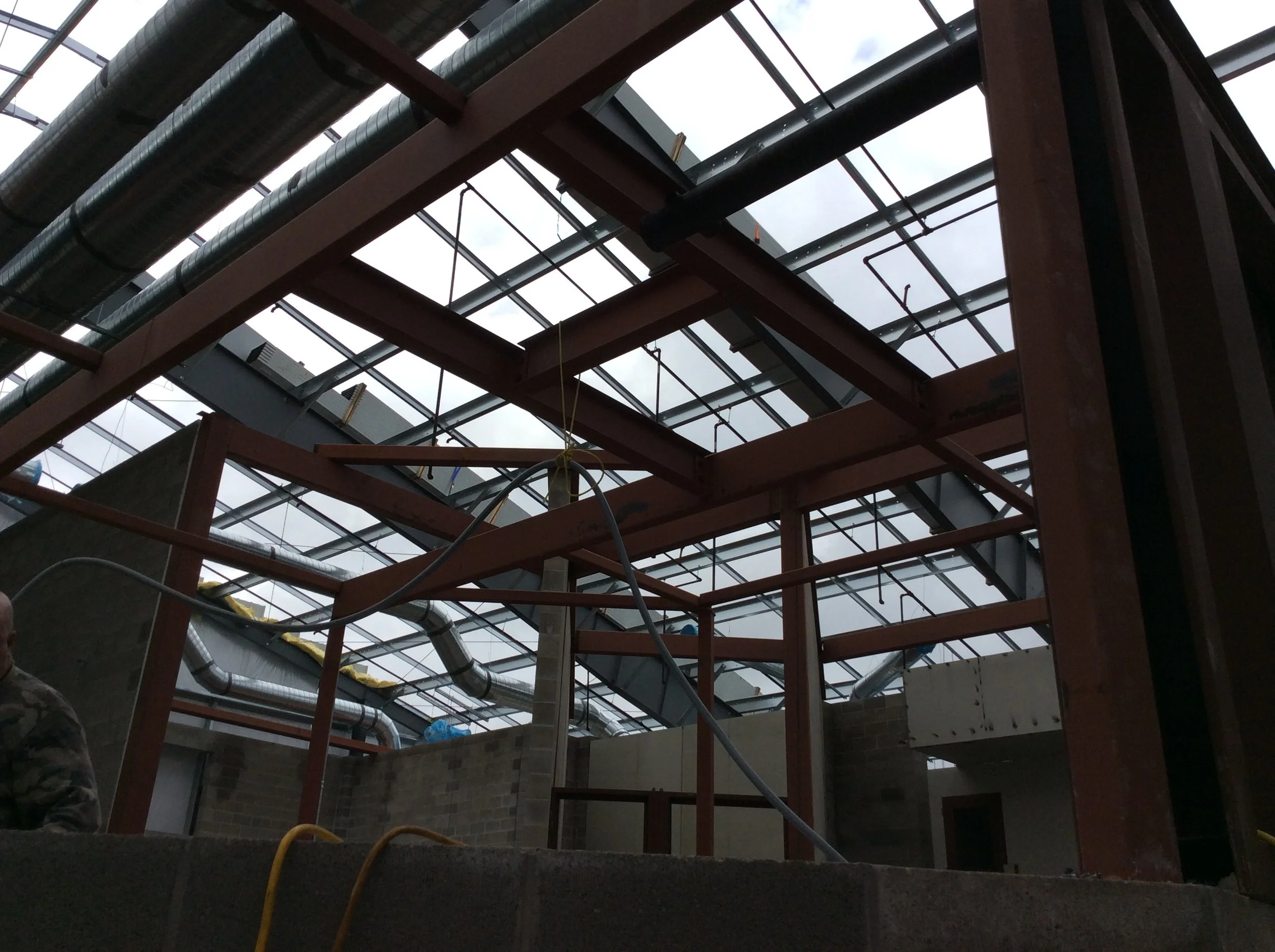 Structural steel framing under construction at project site.