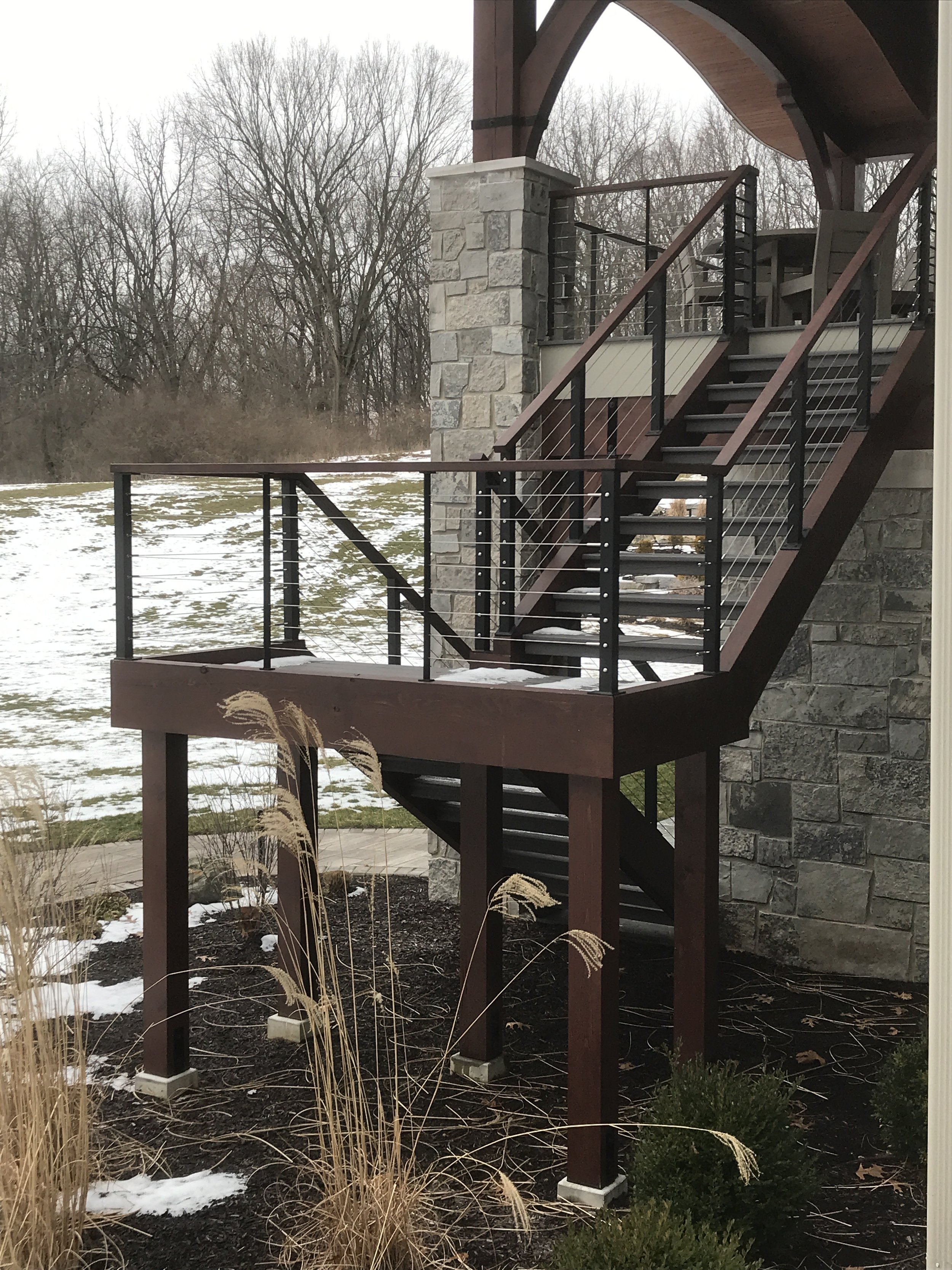 Exterior residential stair with custom metal railing.
