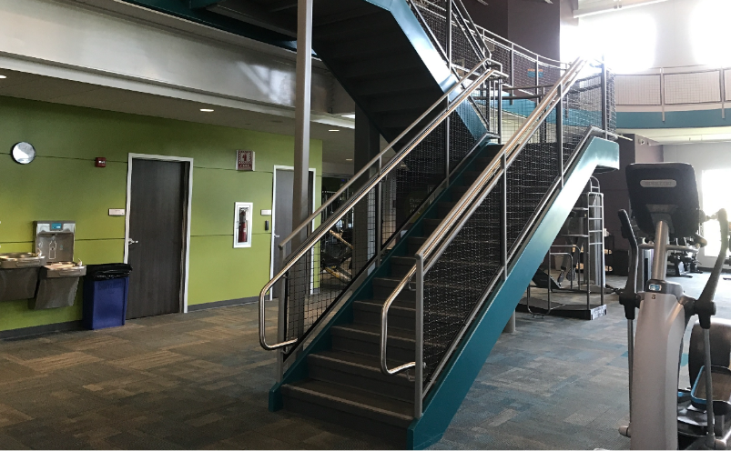 Interior Steel Stair and Guardrail System with Mesh Infill.