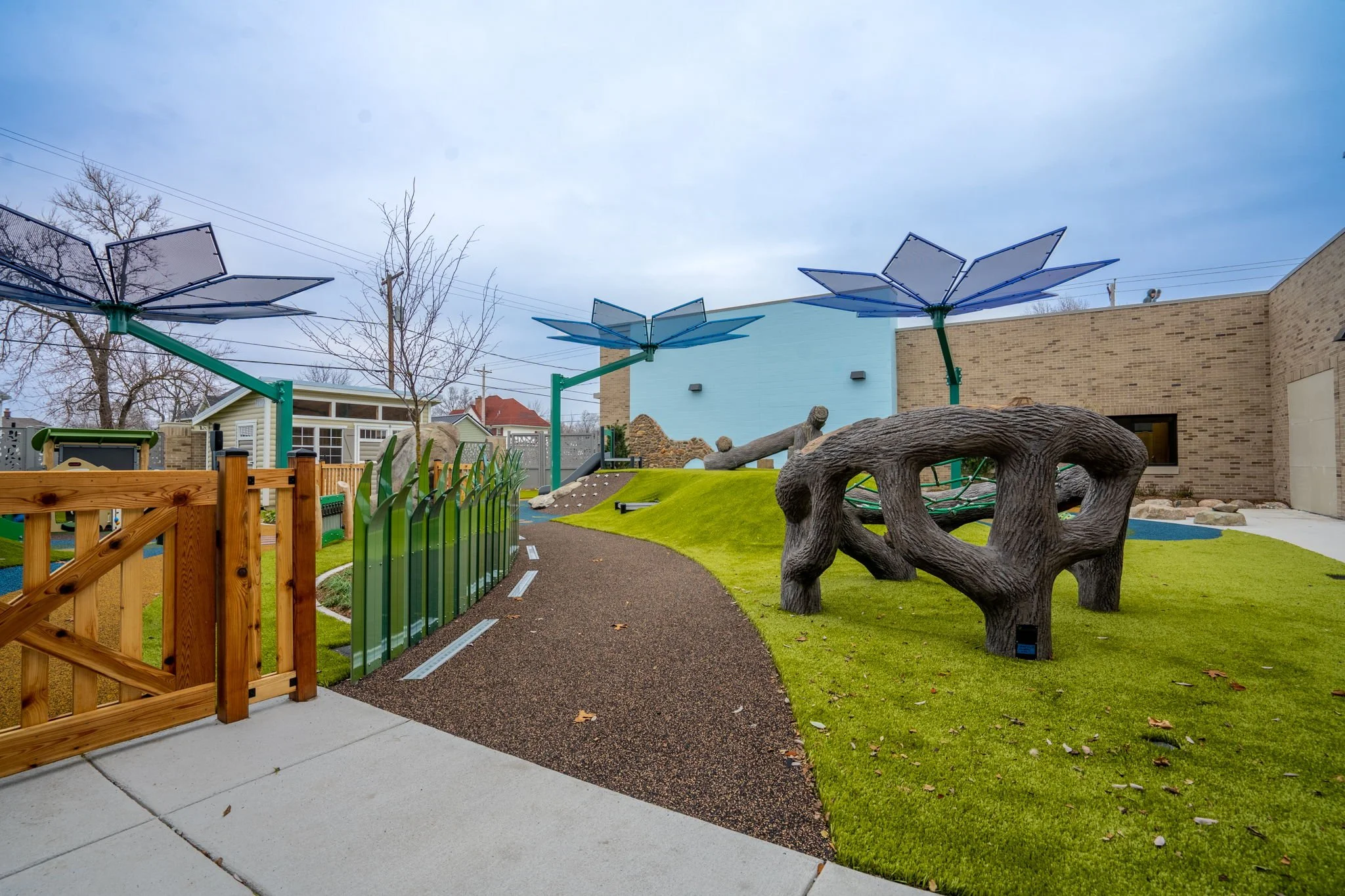 Completed Playground Featuring Custom Metal Fencing and Integrated Site Elements.