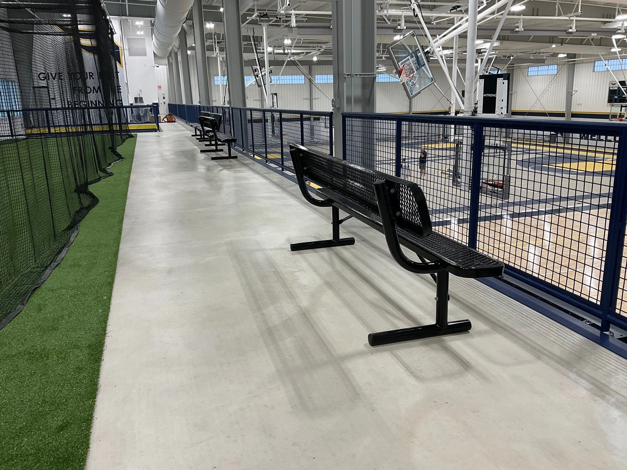 Custom Guardrail System Providing Safety and Visibility Along Upper-Level Athletic Court Walkways.
