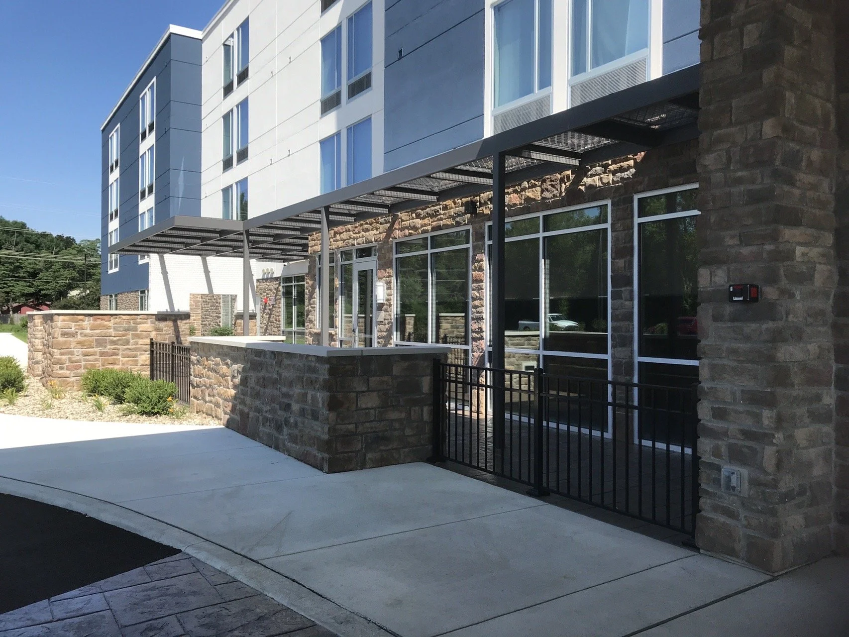 Custom metal entry canopy fabricated for a commercial building entrance.