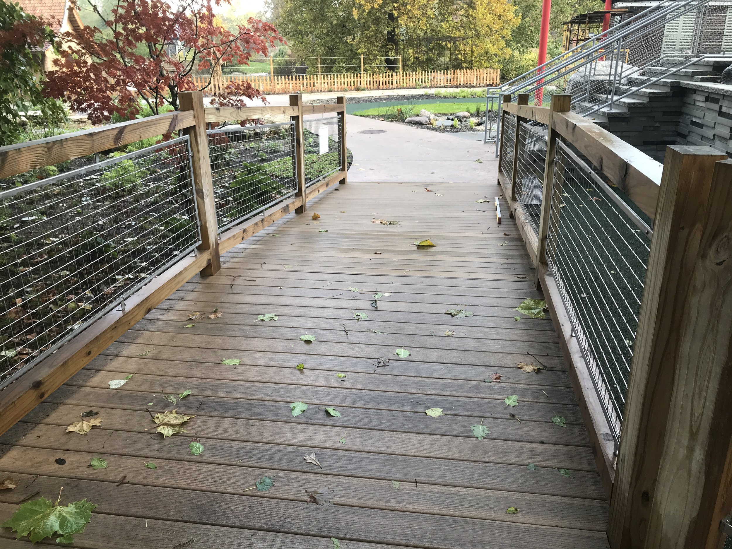 Wood Pedestrian Walkway with Cable Railing System Fabricated for Garden Circulation.