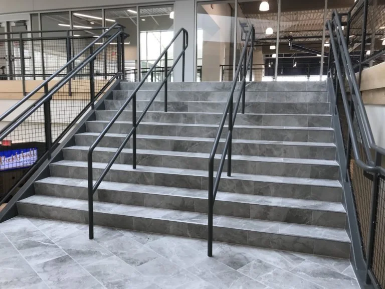 Monumental Interior Stair and Guardrail System Fabricated for Primary Public Circulation.