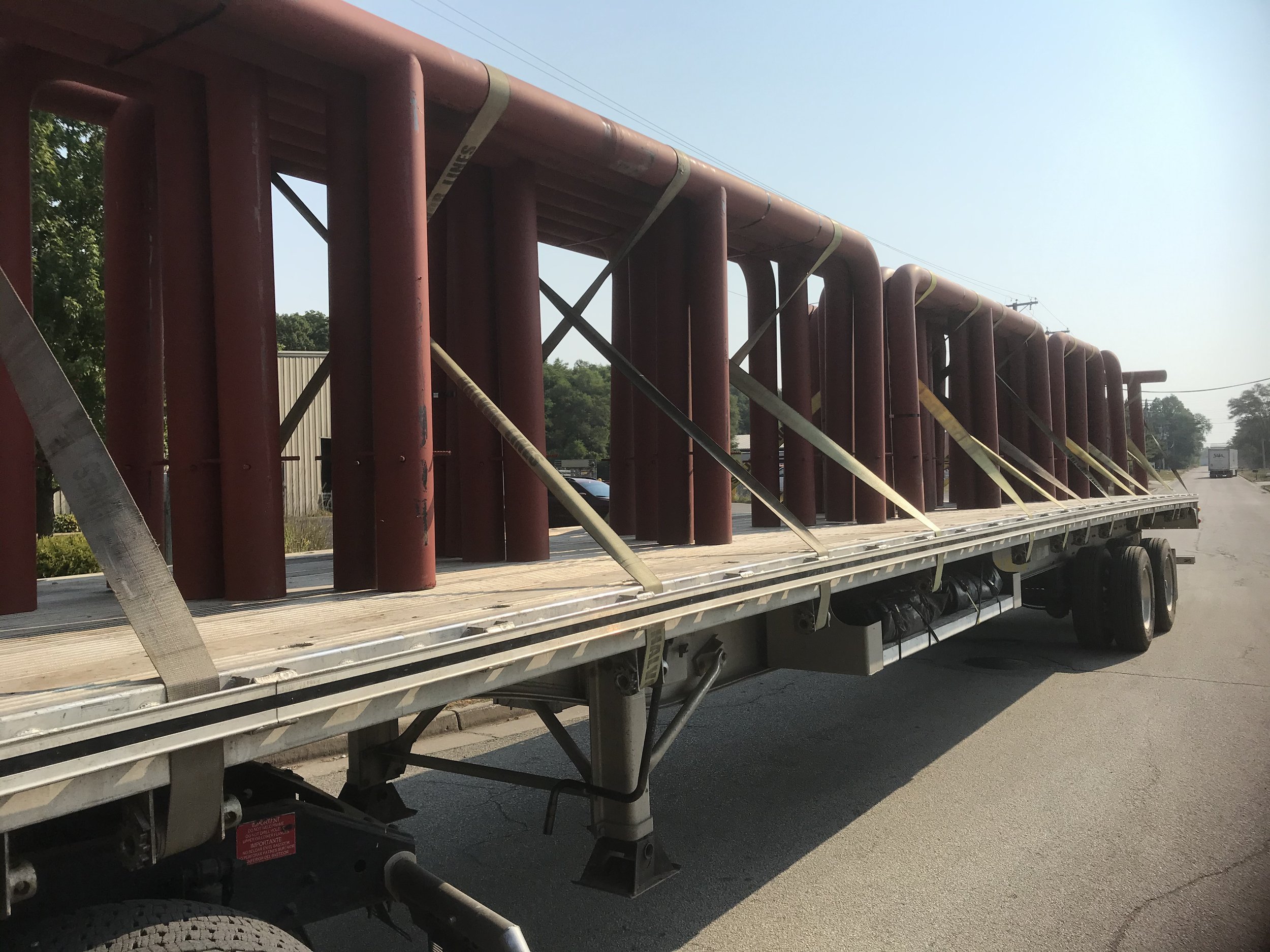 Fabricated steel components loaded for delivery to job site.