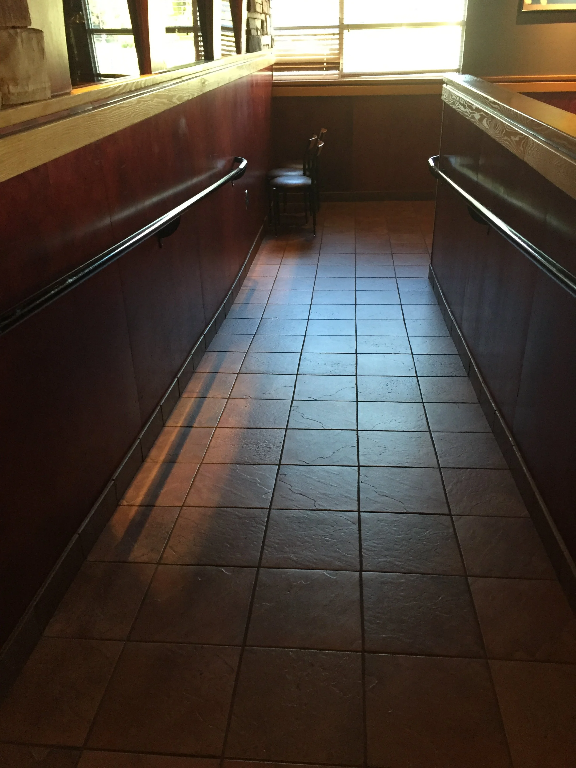Custom Handrails Installed Along an Accessible Interior Ramp.