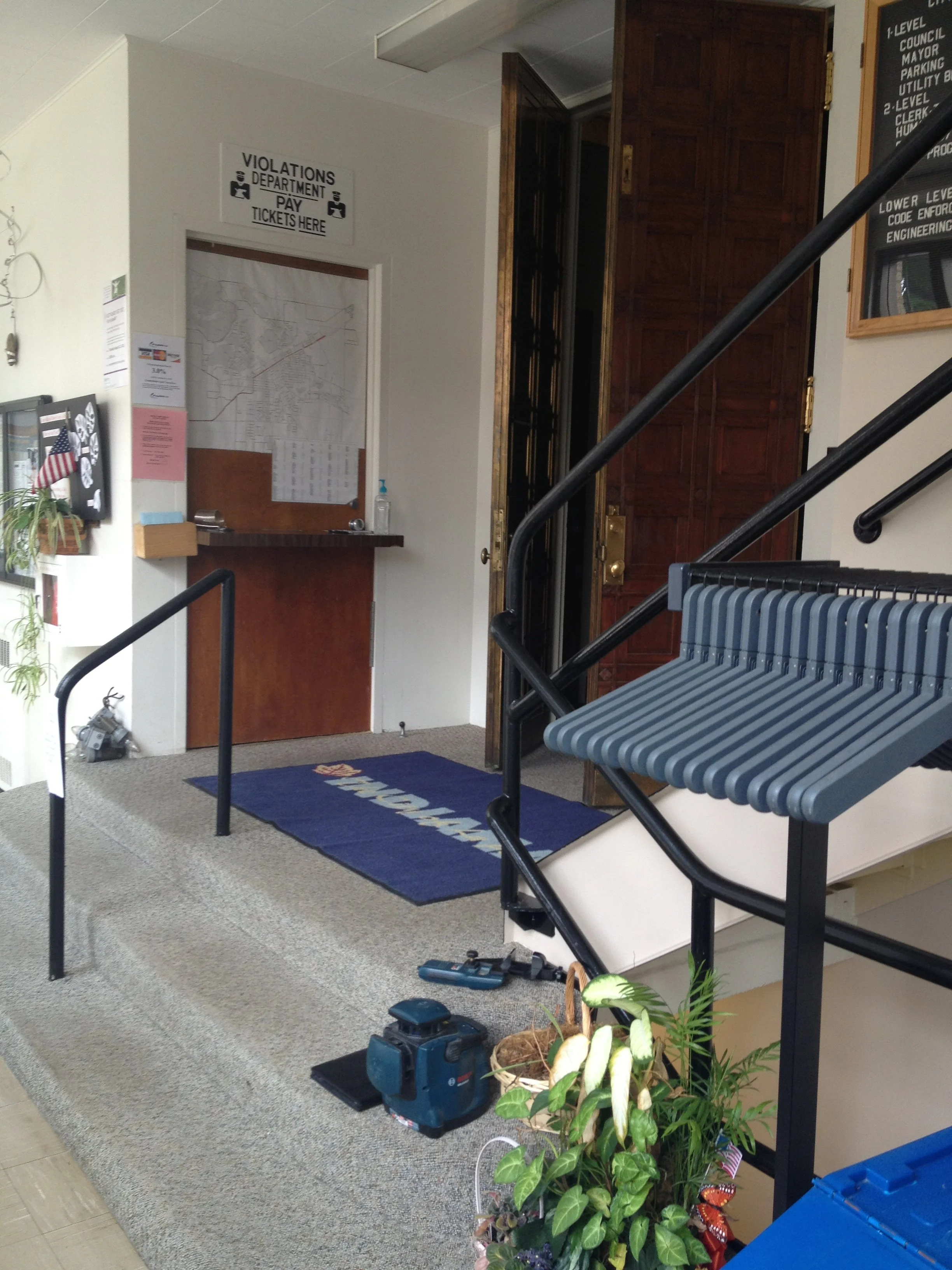 Custom Fabricated Stair and Queue Railings Integrated Into the Historic City Hall Interior.