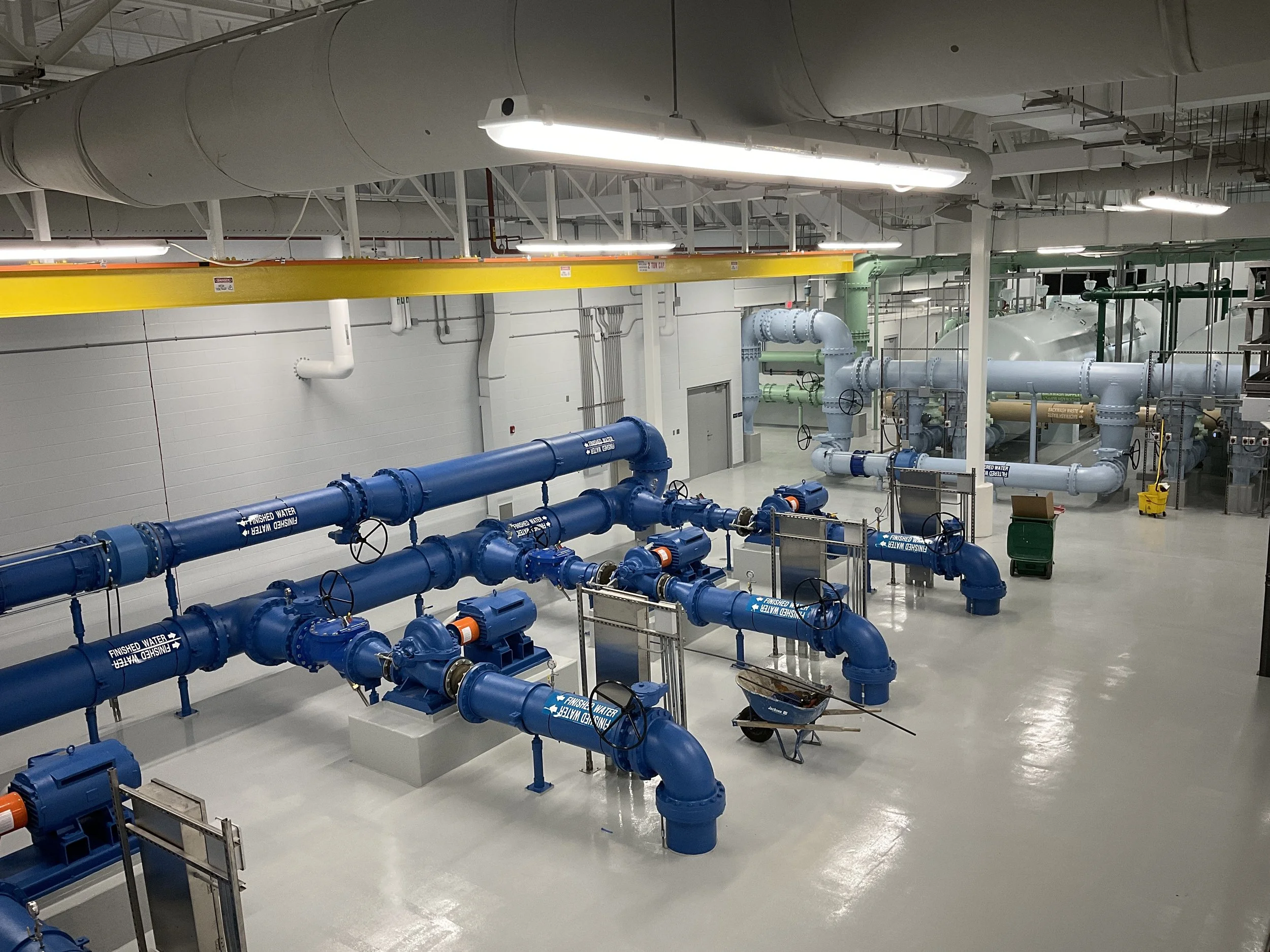 Industrial steel access platforms and railings inside water treatment facility.