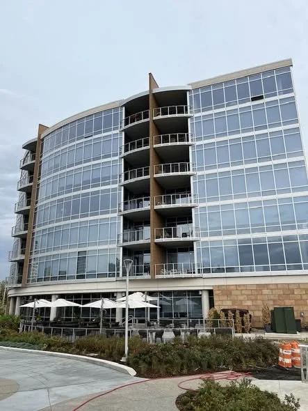Exterior Railings Integrated into the Building Façade and Outdoor Dining Terrace.