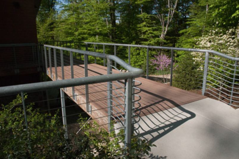 Exterior Deck and Cable Guardrails Integrated with Building Façades and Surrounding Landscape.