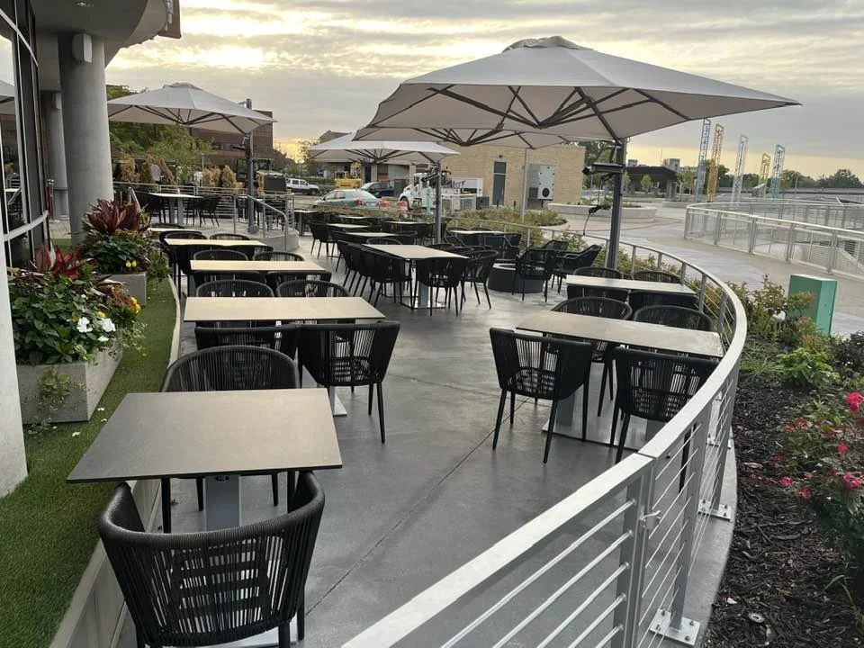 Completed Patio Railing Installation Supporting an Active Outdoor Dining Environment.