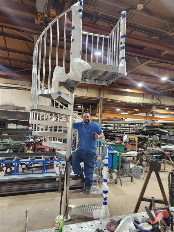 Fabricated steel spiral staircase during shop assembly at Evans Metal Products.
