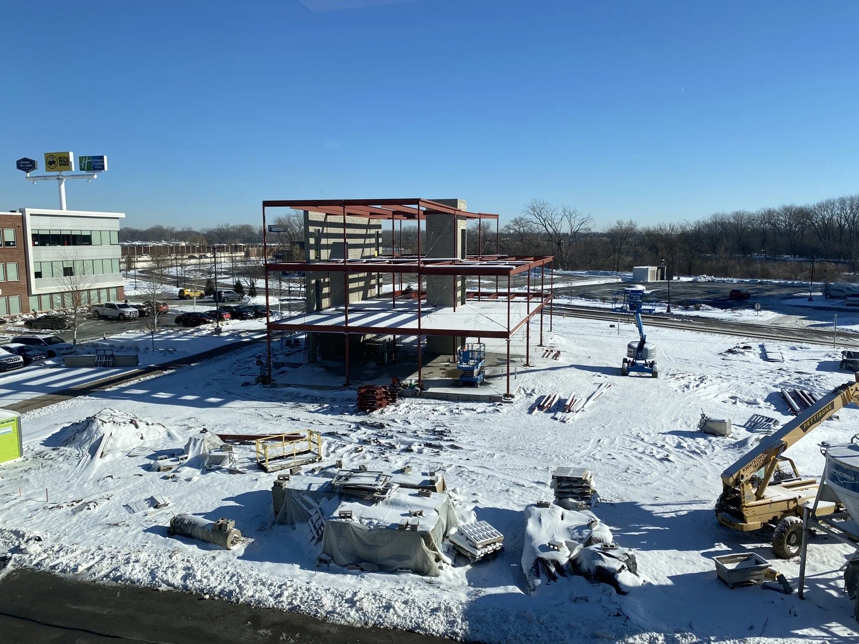 Structural steel frame under construction at a commercial project site.