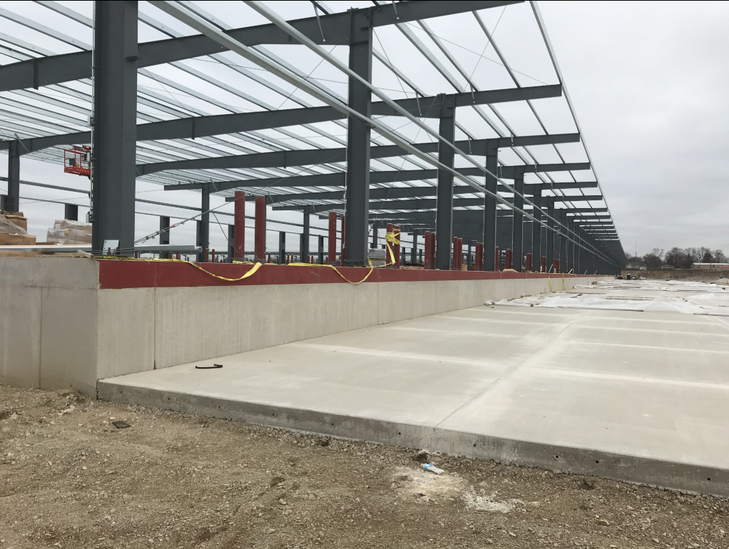 Structural steel framing under construction at a commercial project site.