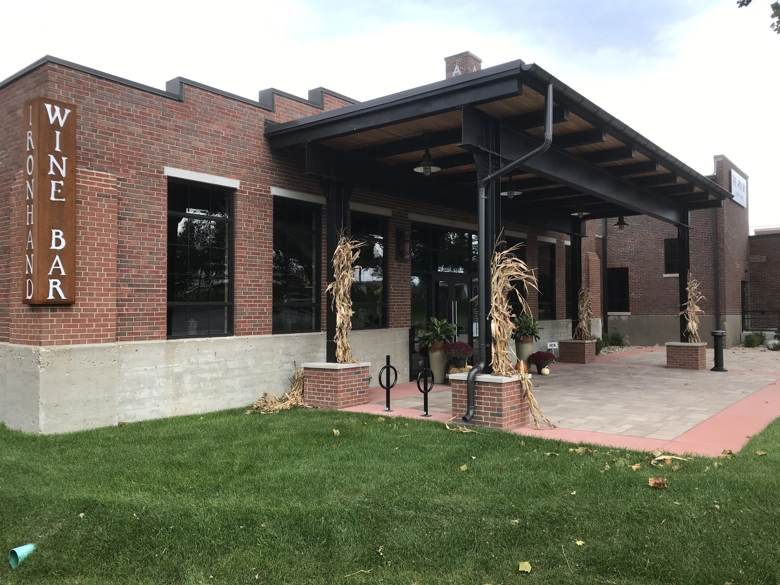 Exterior metal entry canopy at Iron Hand Wine Bar.