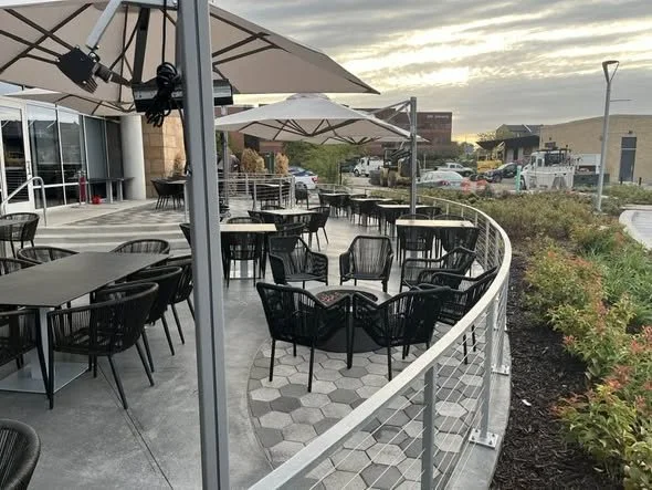 Smooth, Continuous Railing Lines Designed to Follow the Patio's Curved Layout.