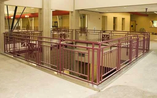 Custom Interior Metal Balcony Railings Enclosing the Atrium Space at Holy Cross College.
