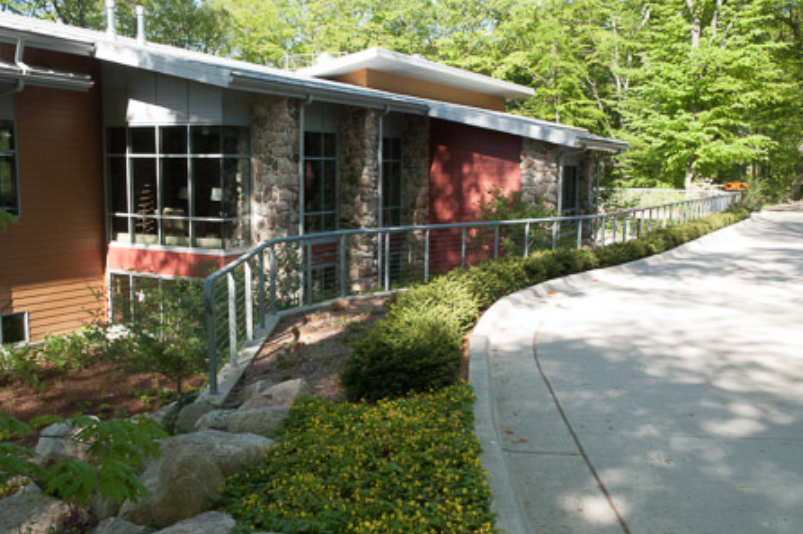 Exterior Guardrail System Integrated with Landscape Features and Site Retaining Walls.