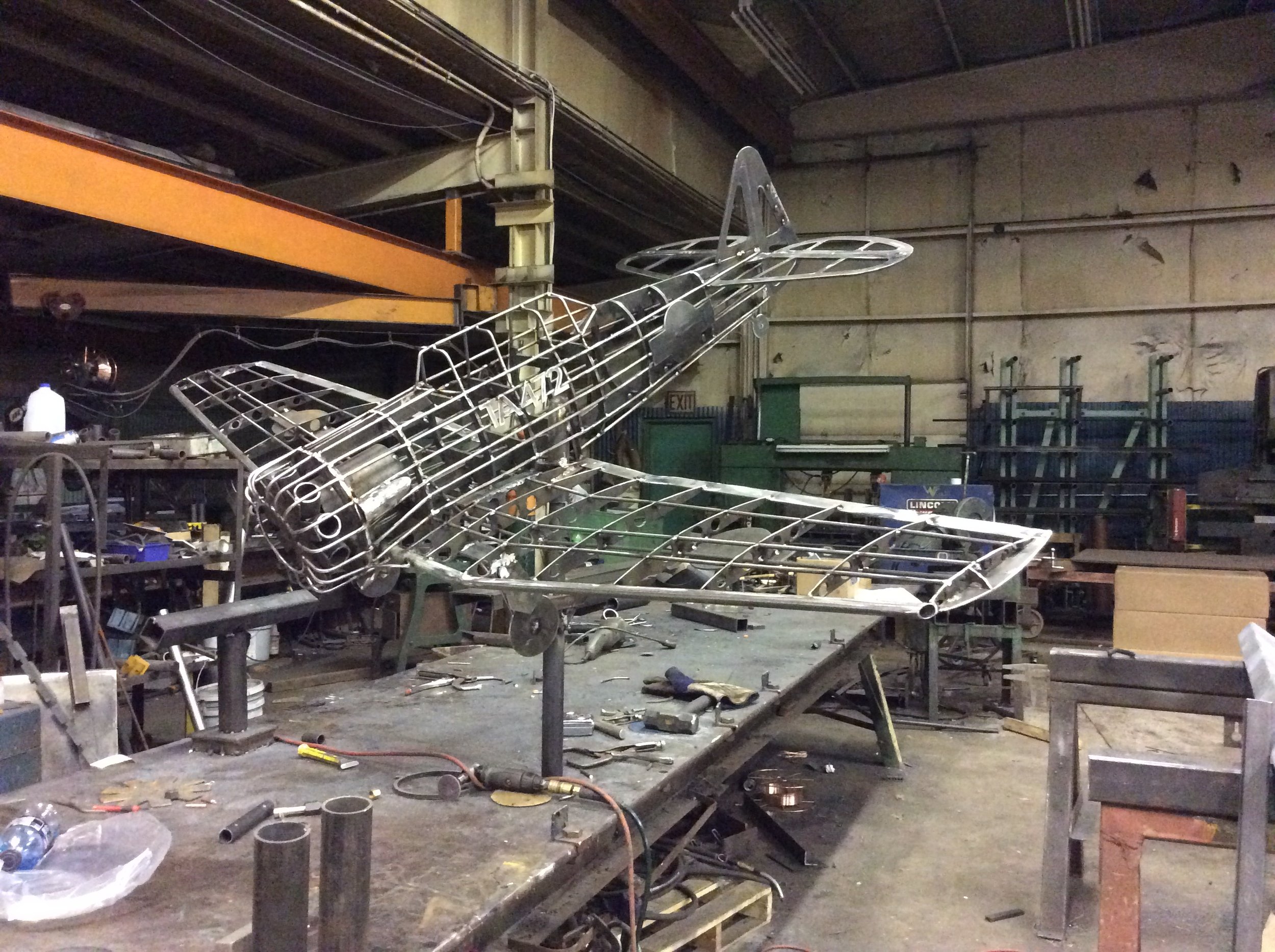 Custom metal framework fabricated for airplane model display.