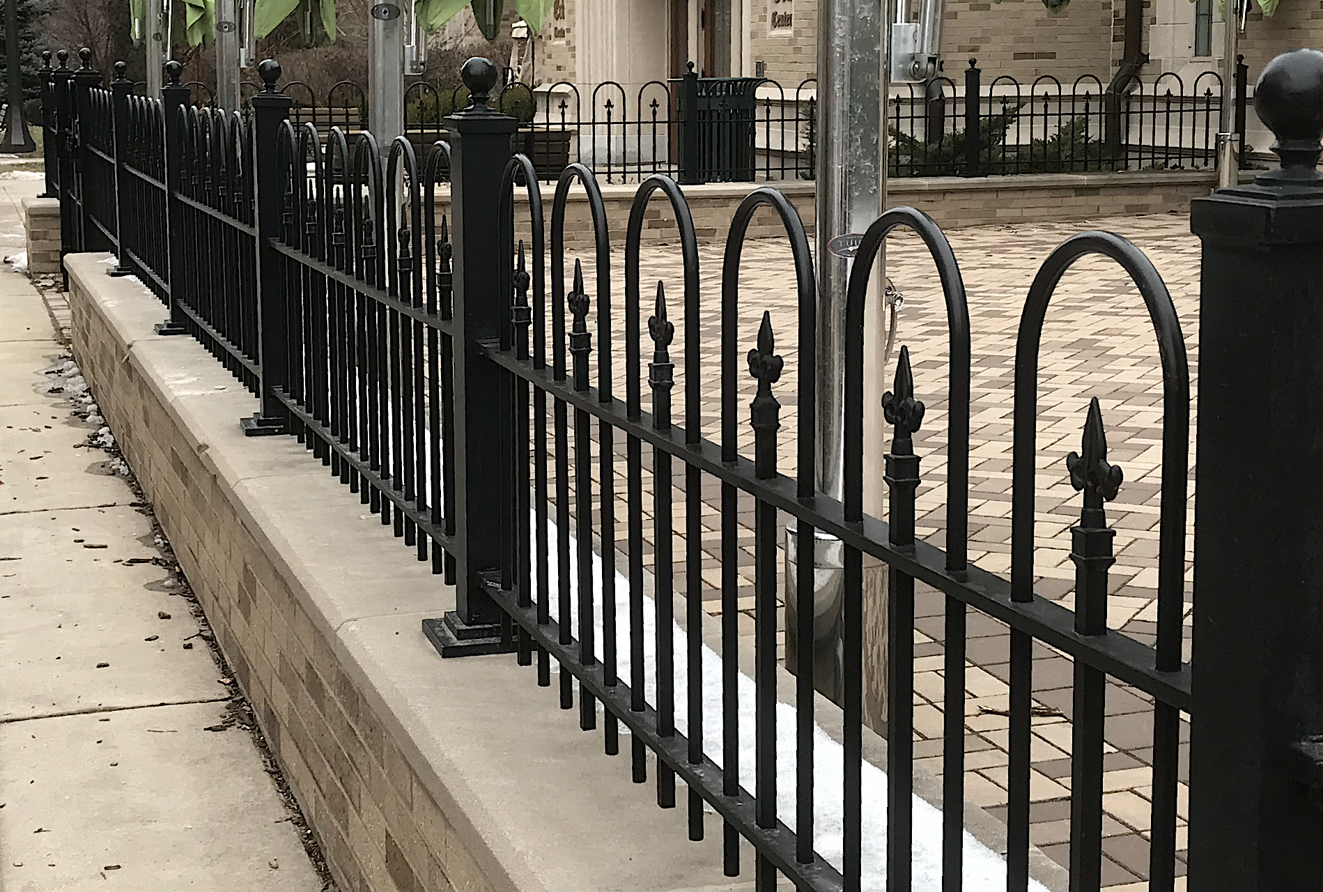 Custom Fabricated Ornamental Fence Panels Designed to Complement the Architecture of the Eck Visitors Center at Notre Dame.