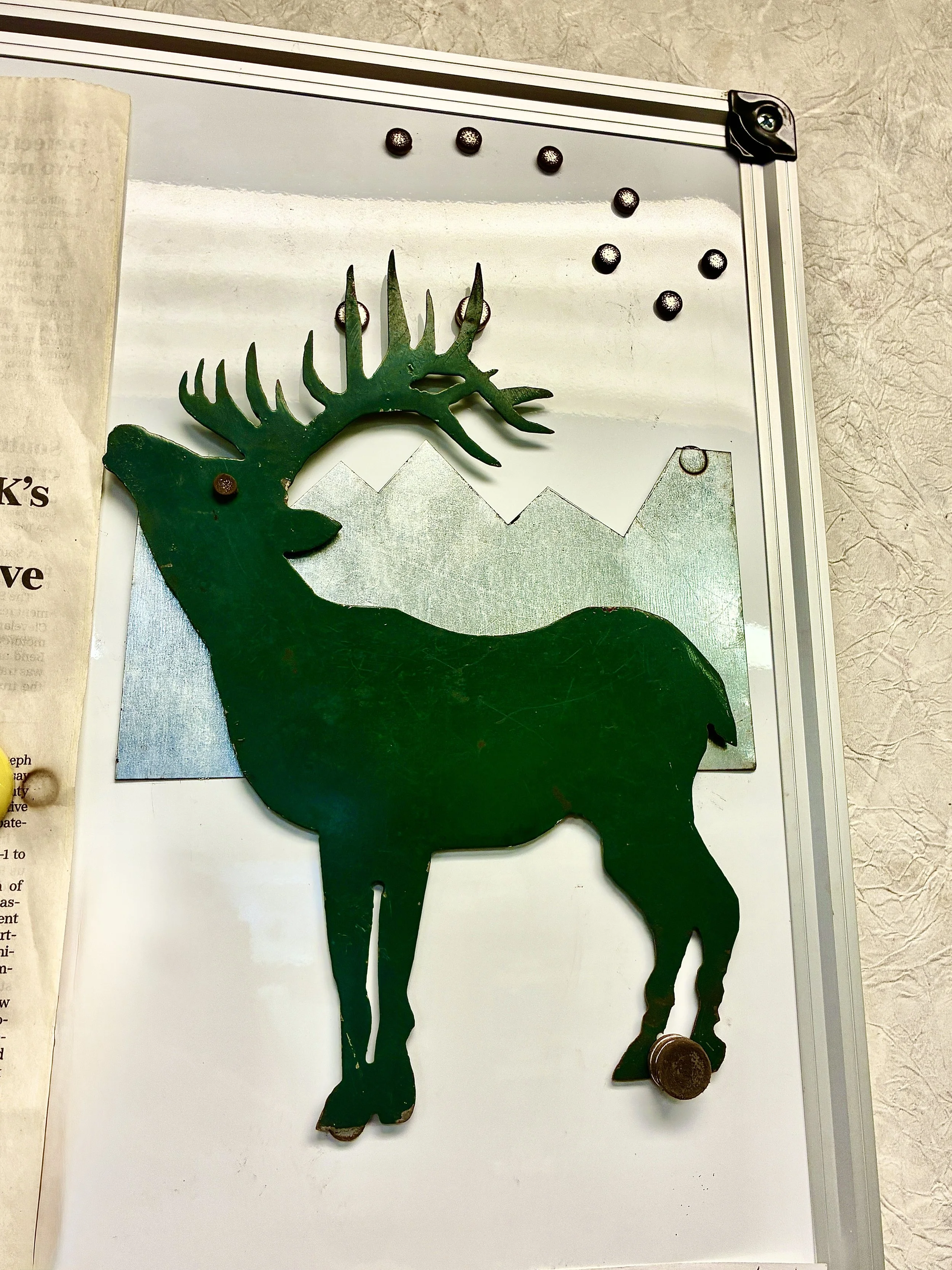 Custom fabricated metal reindeer cutout.