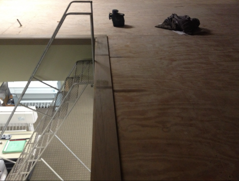 Interior stair and landing with custom metal railing.