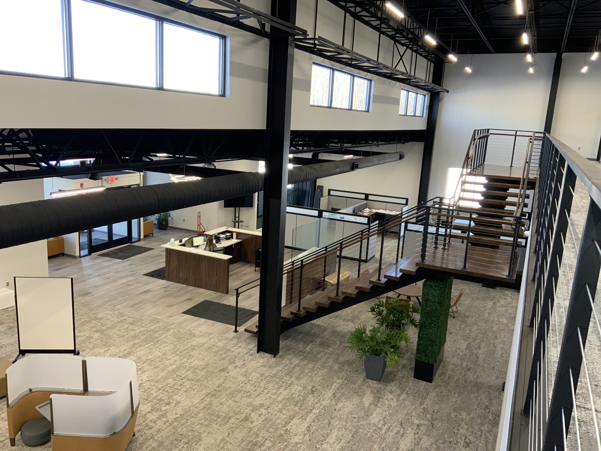 Interior office stair with custom metal railing.