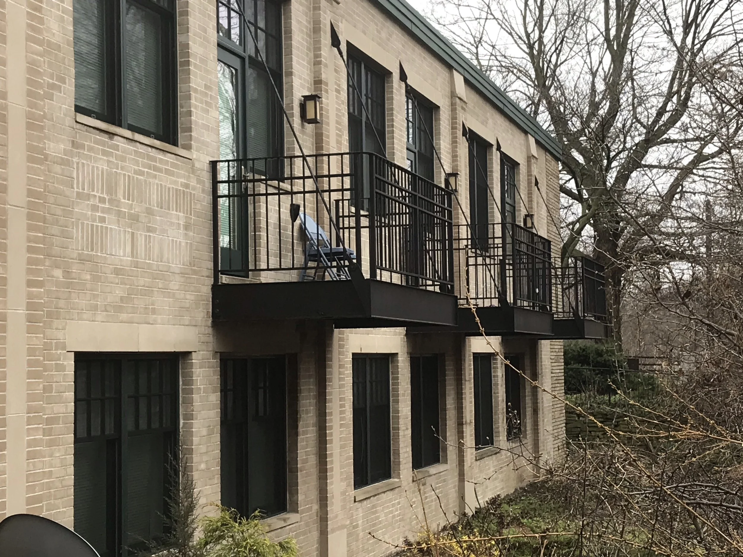 Residential building with exterior metal balcony railings.