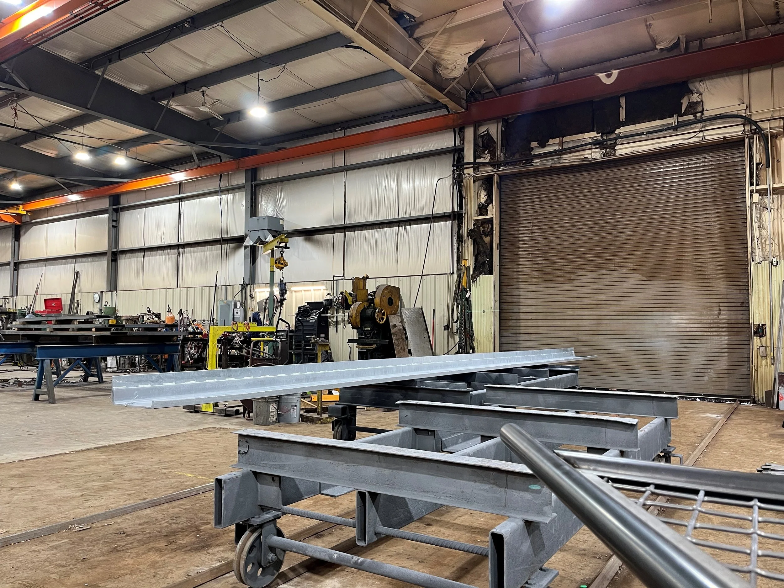 Custom steel material carts designed and fabricated by Evans Metal Products for moving metal stock through the fabrication shop.