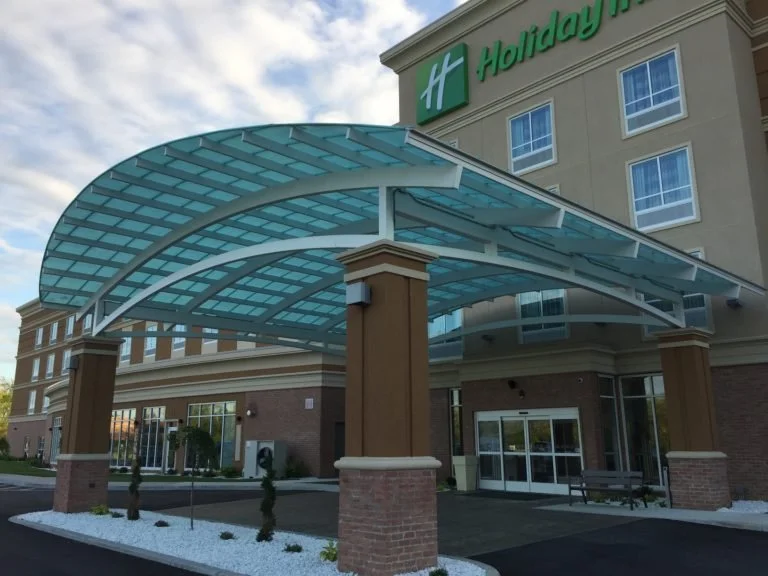 Custom Steel and Glass Canopy System Fabricated to Provide Pedestrian Weather Protection.