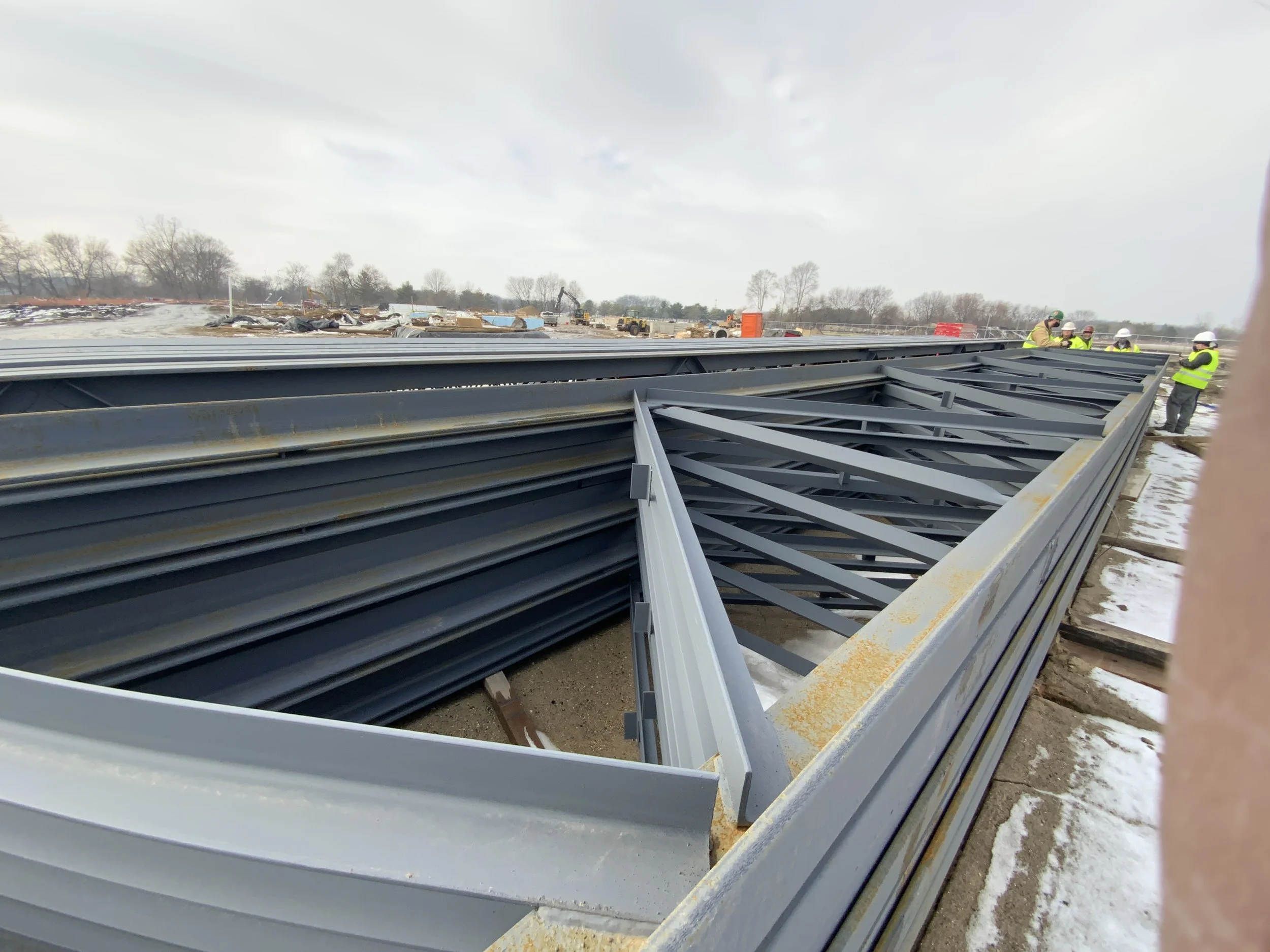Structural steel components inspected during installation at project site.
