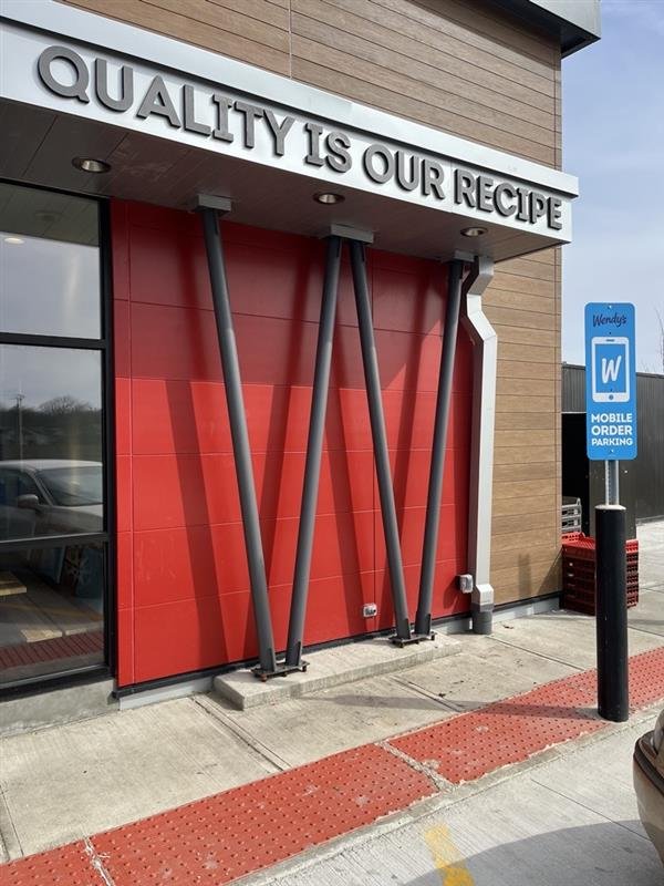 Custom metal entry elements fabricated for a Wendy’s restaurant.