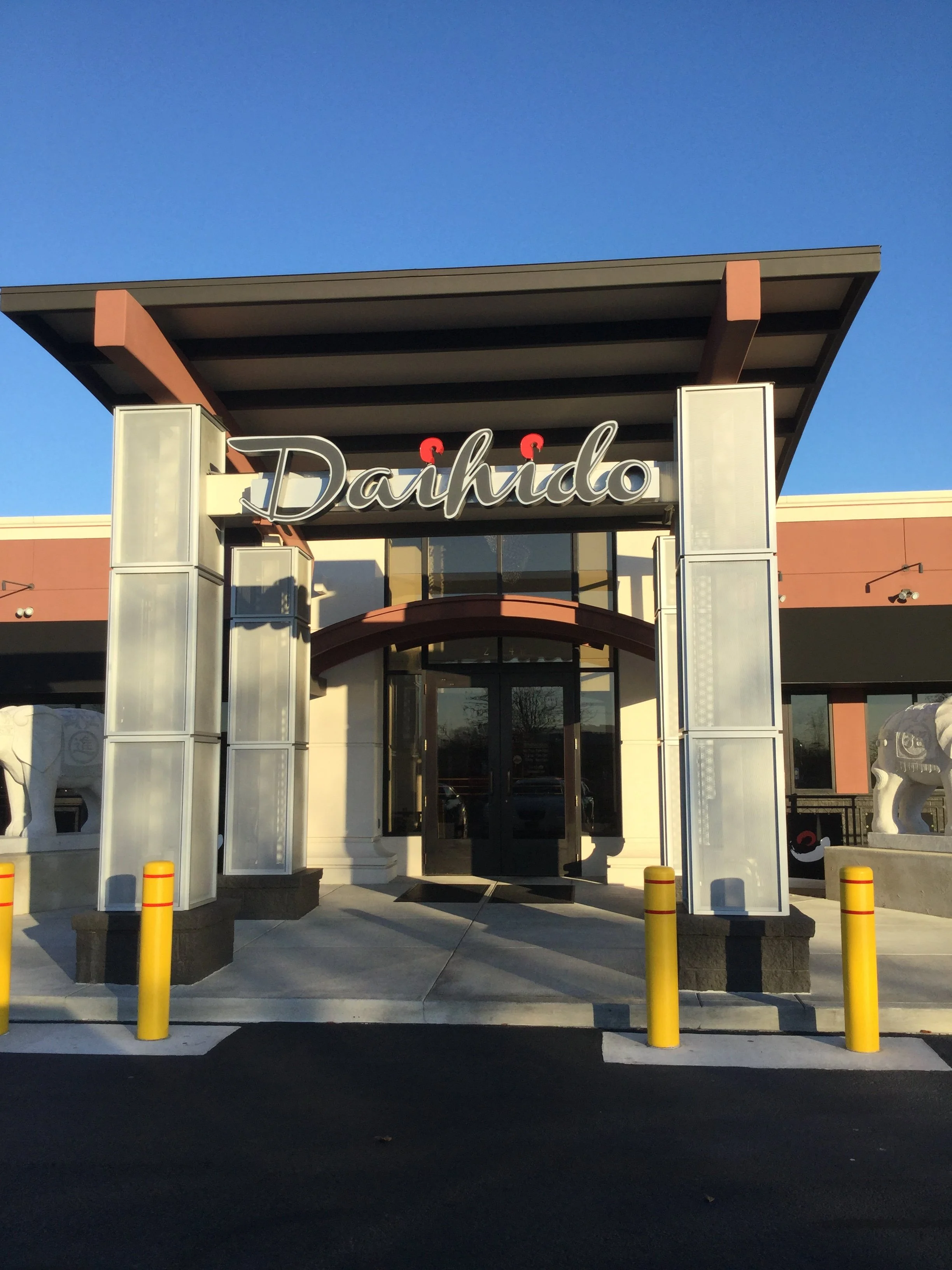 Architectural Steel Canopy and Column System Forming the Primary Entrance.