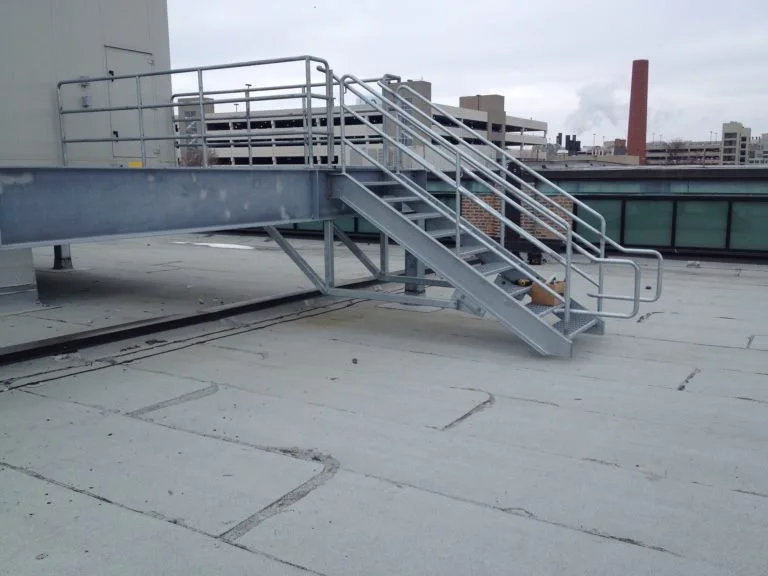 Steel rooftop stair and guardrail system fabricated for roof access.